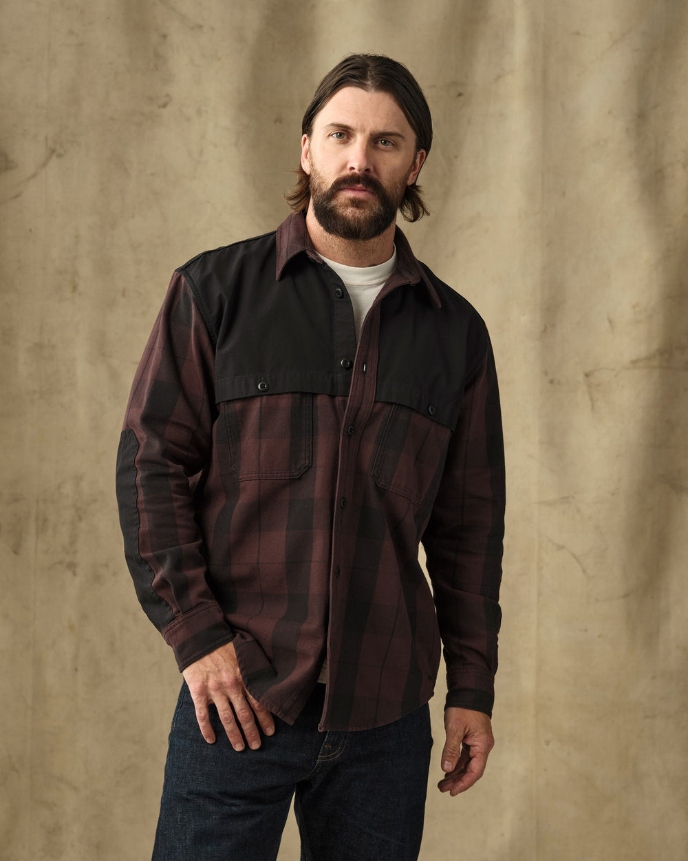 image of a model wearing Filson's Forester Flannel Shirt - Dark Port Plaid