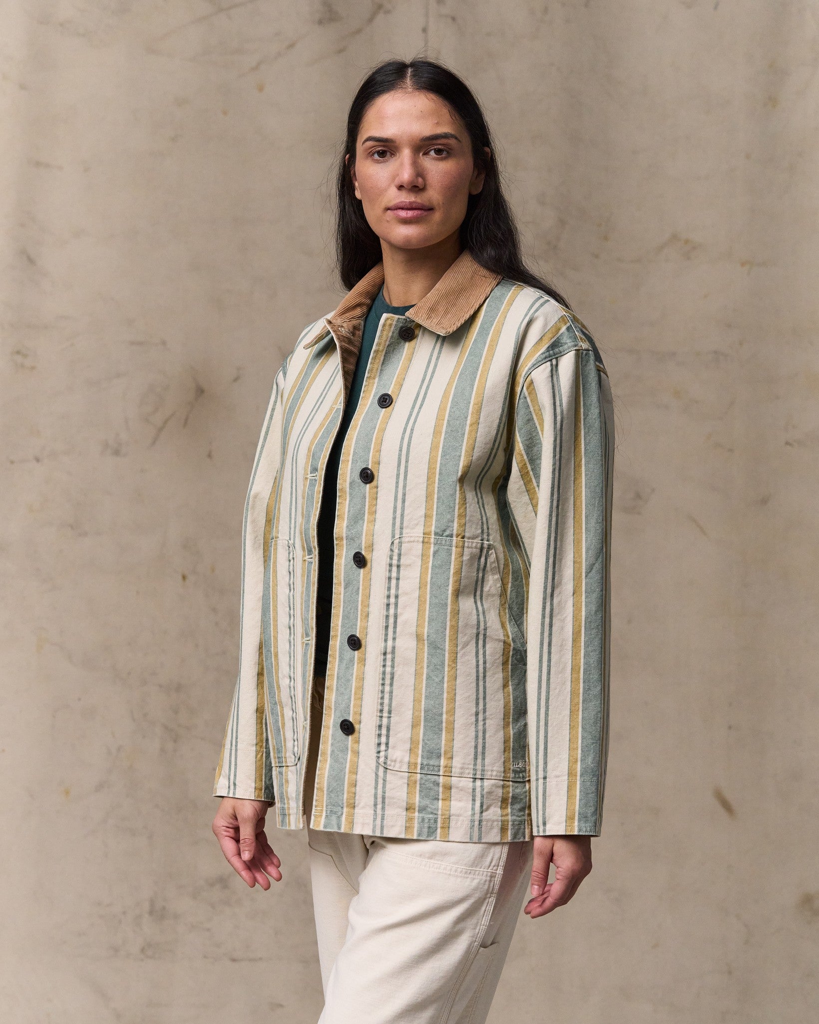 image of a model wearing Filson's Women's Canvas Barn Coat - Natural / Yellow