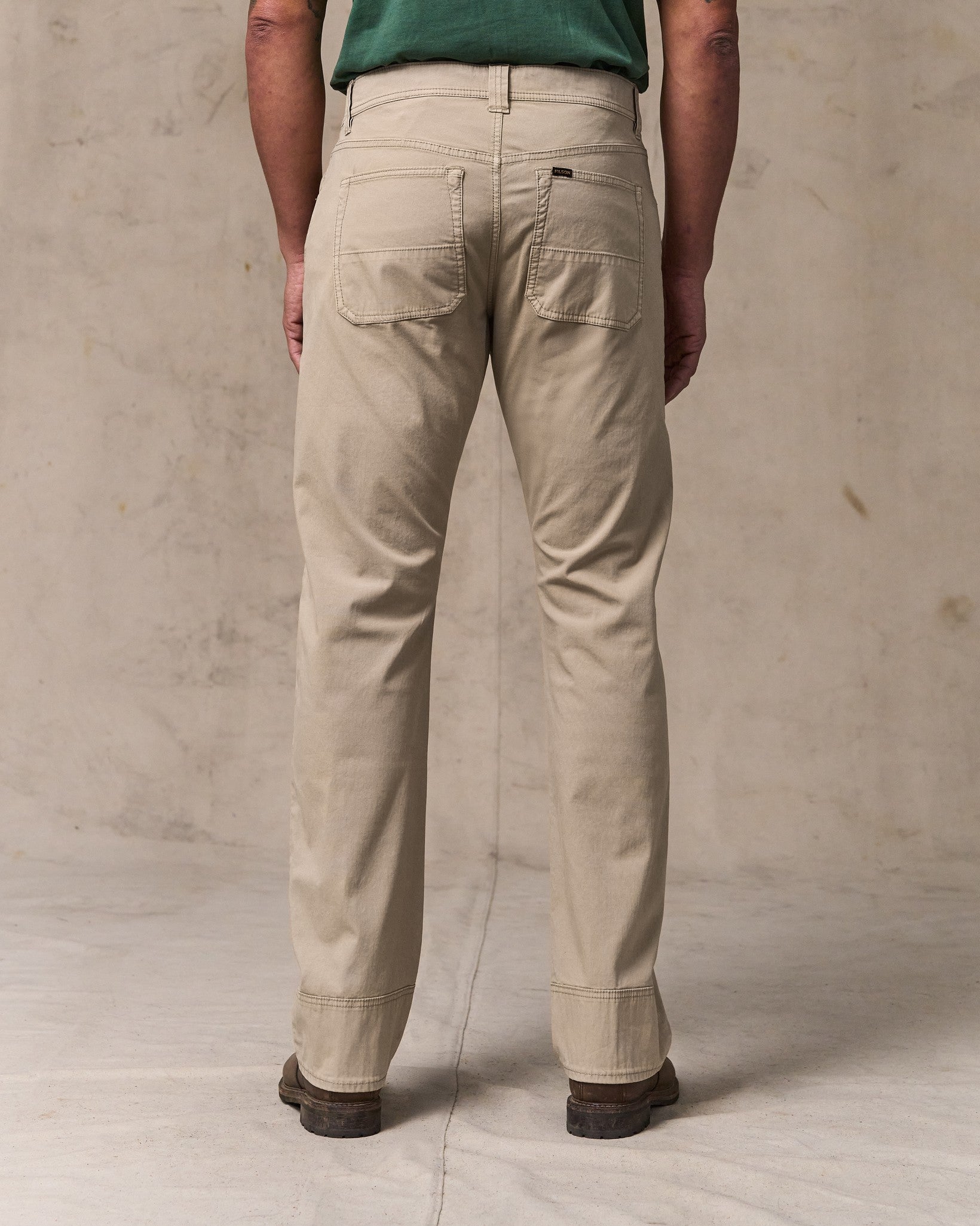 image of a model wearing Filson's Granite Mountain 5-pocket Pants - Buck Tan