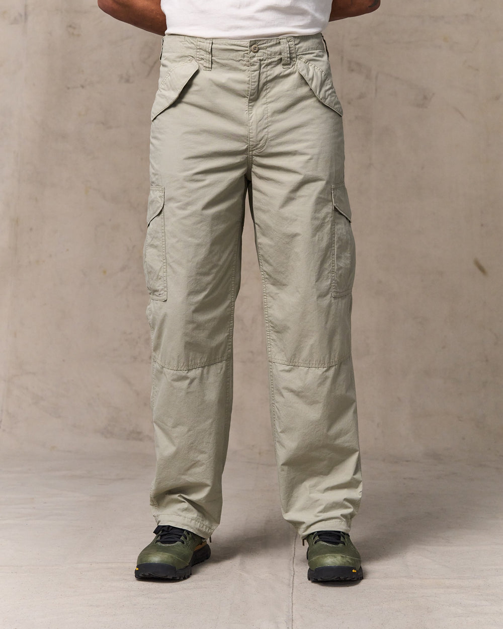 image of a model wearing Filson's Tropical Poplin Cargo Pants - Dried Sage