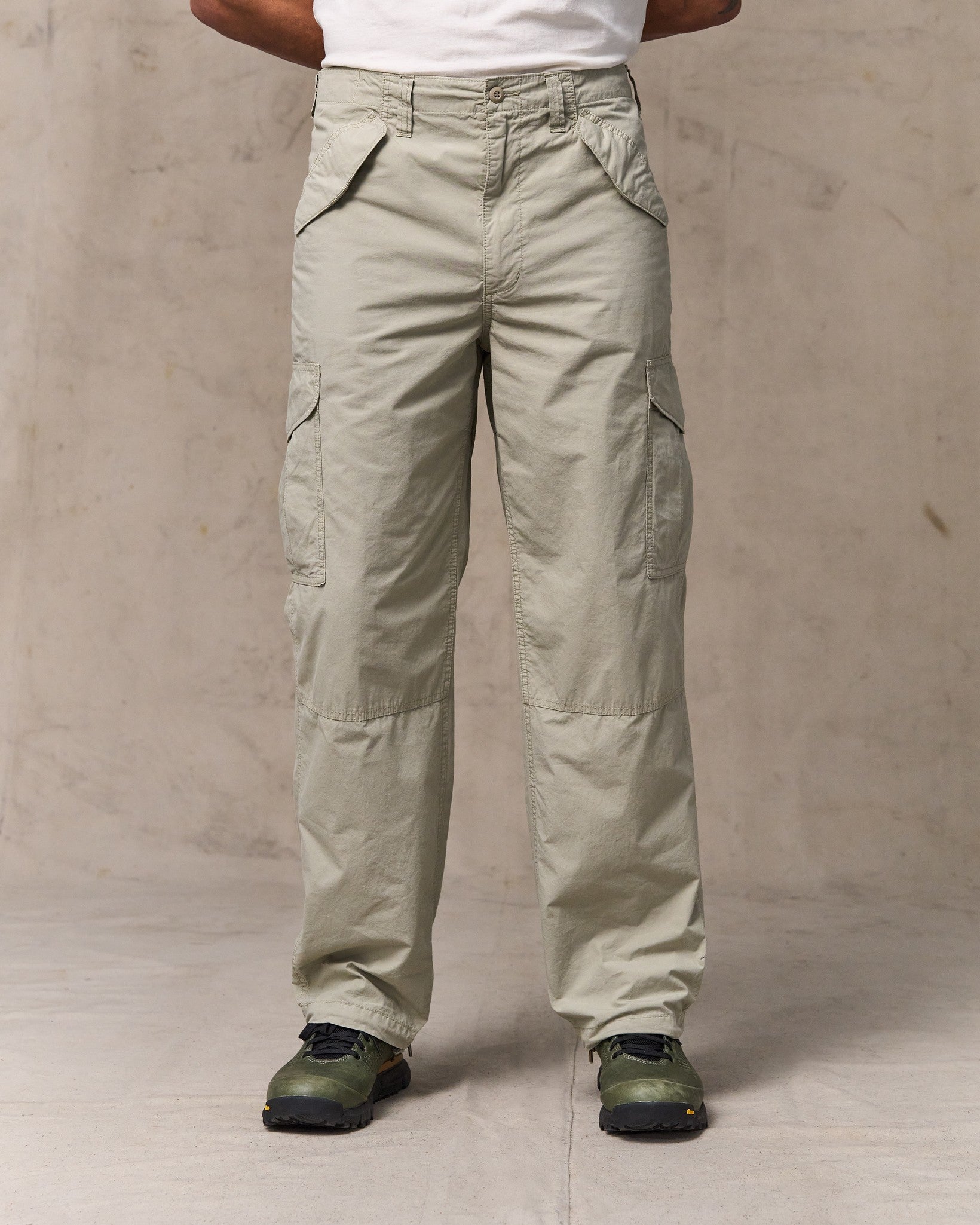 image of a model wearing Filson's Tropical Poplin Cargo Pants - Dried Sage