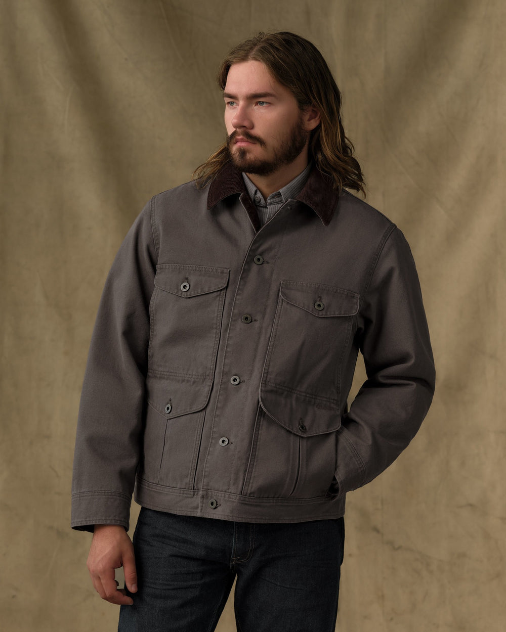 image of a model wearing Filson's Rustic Canvas Journeyman Jacket - Bark