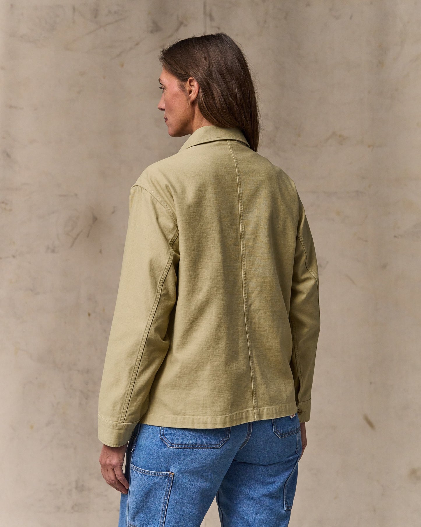image of a model wearing Filson's Women's Reverse Sateen Cruiser Jacket - Antique Khaki