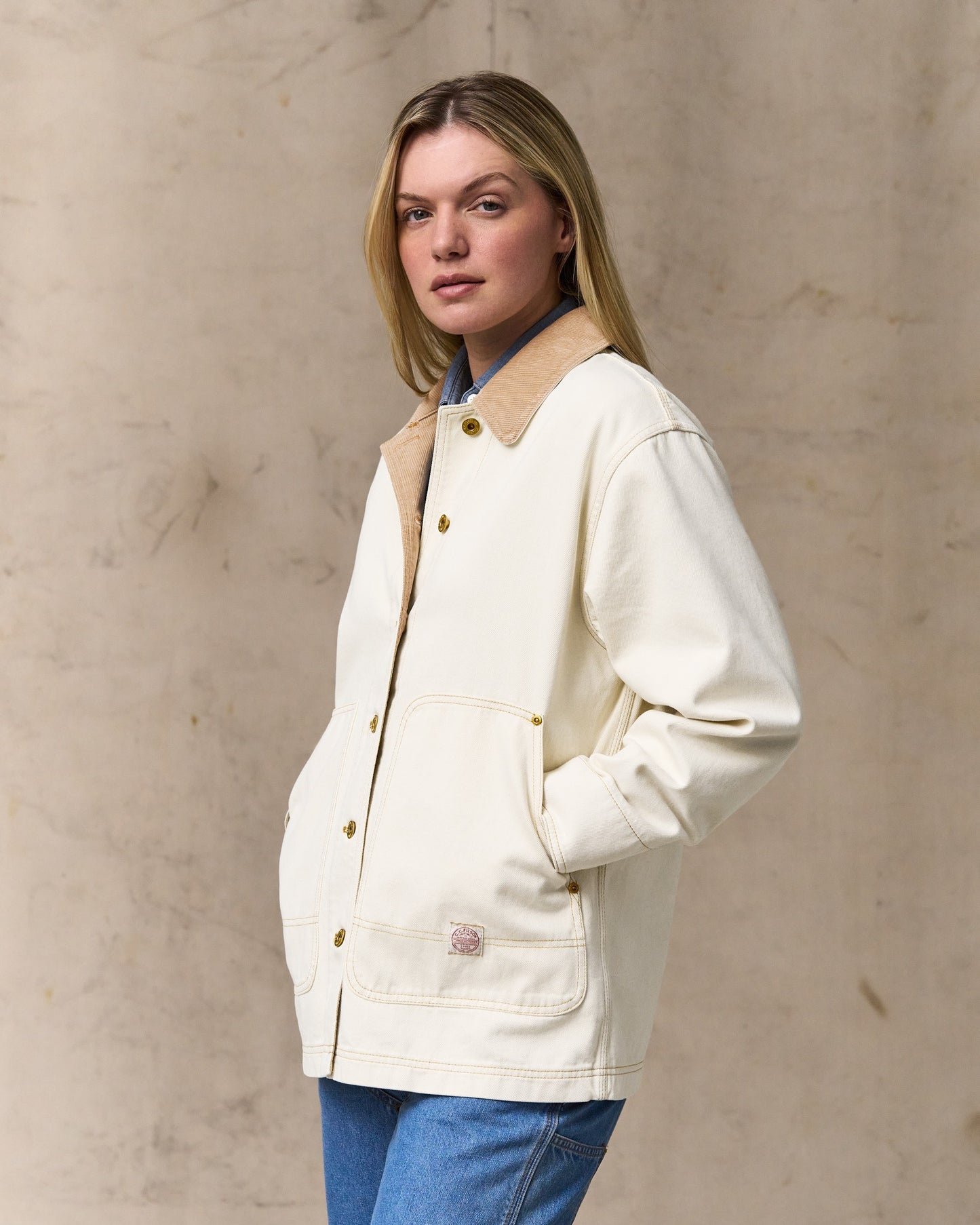 image of a model wearing Filson's Women's 11-oz. Denim Barn Coat - Natural Seed