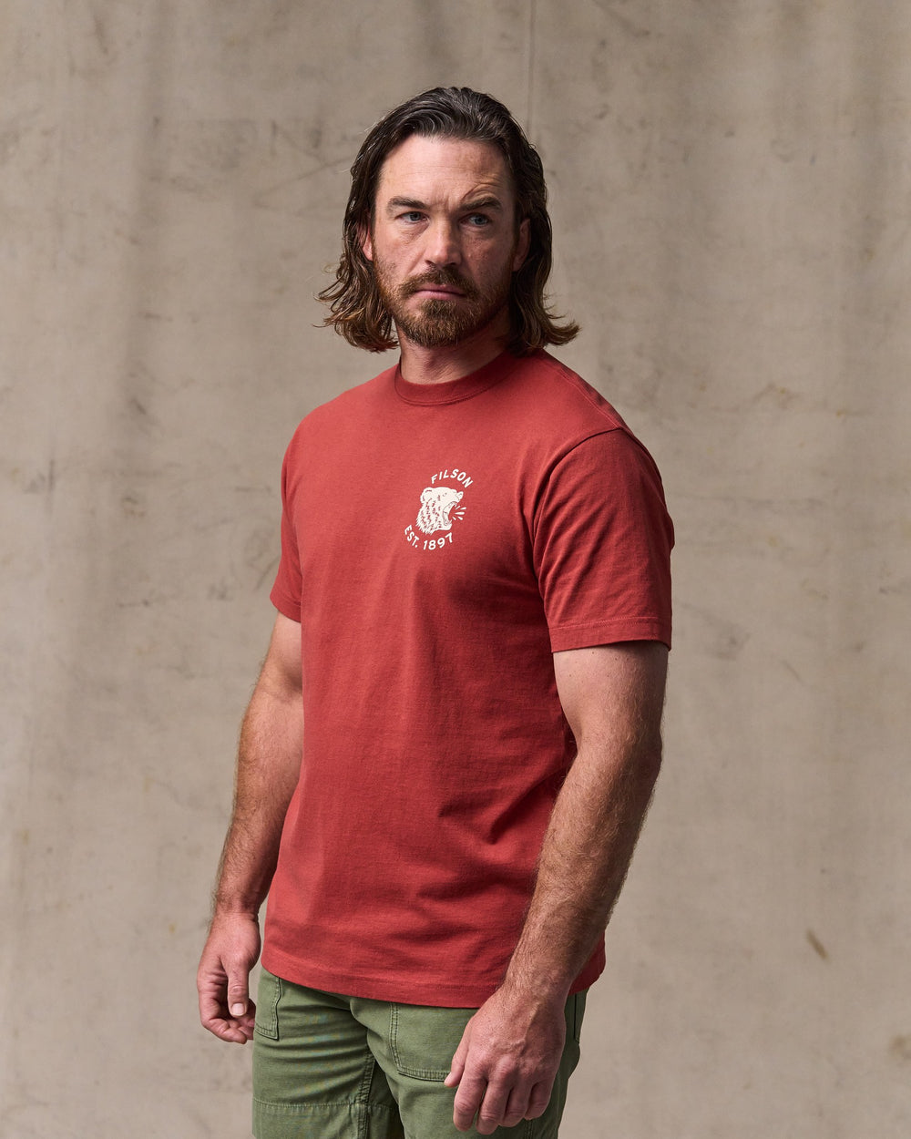 image of a model wearing Filson's Bear Graphic T-shirt - Chili Oil