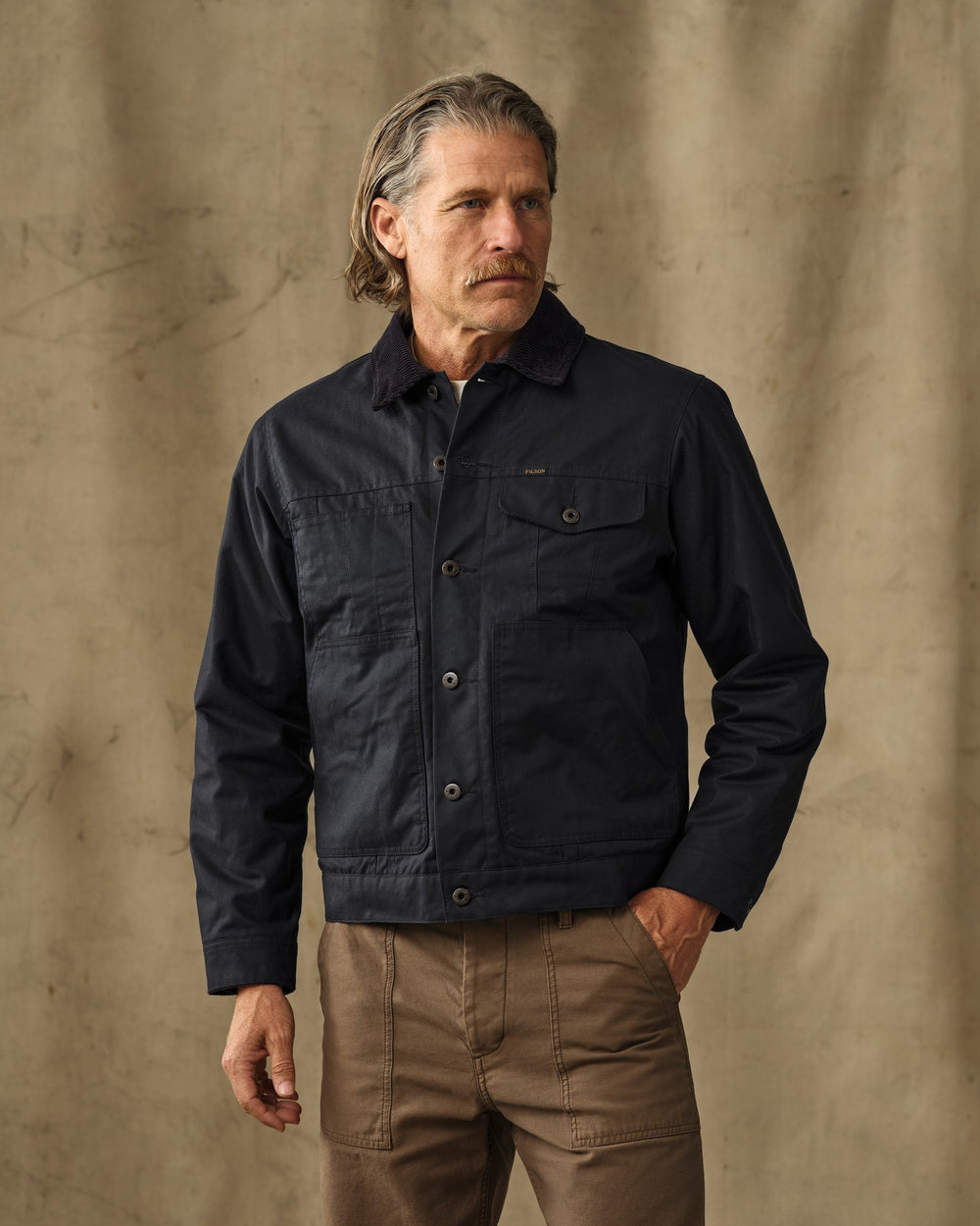 image of a model wearing Filson's Insulated Short Cruiser Jacket - Harbor Blue