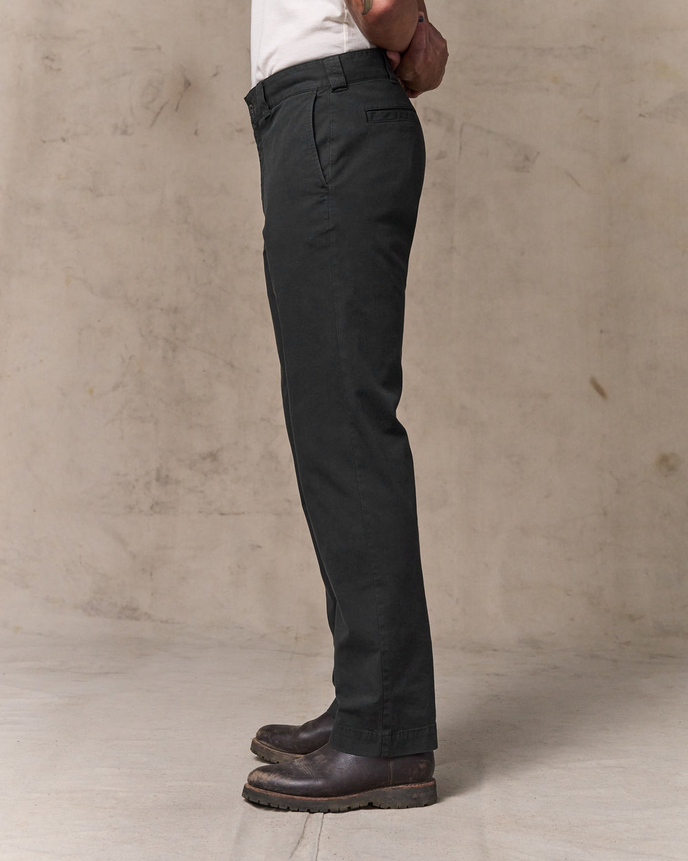 image of a model wearing Filson's Granite Mountain Flat Front Pants - Washed Faded Black