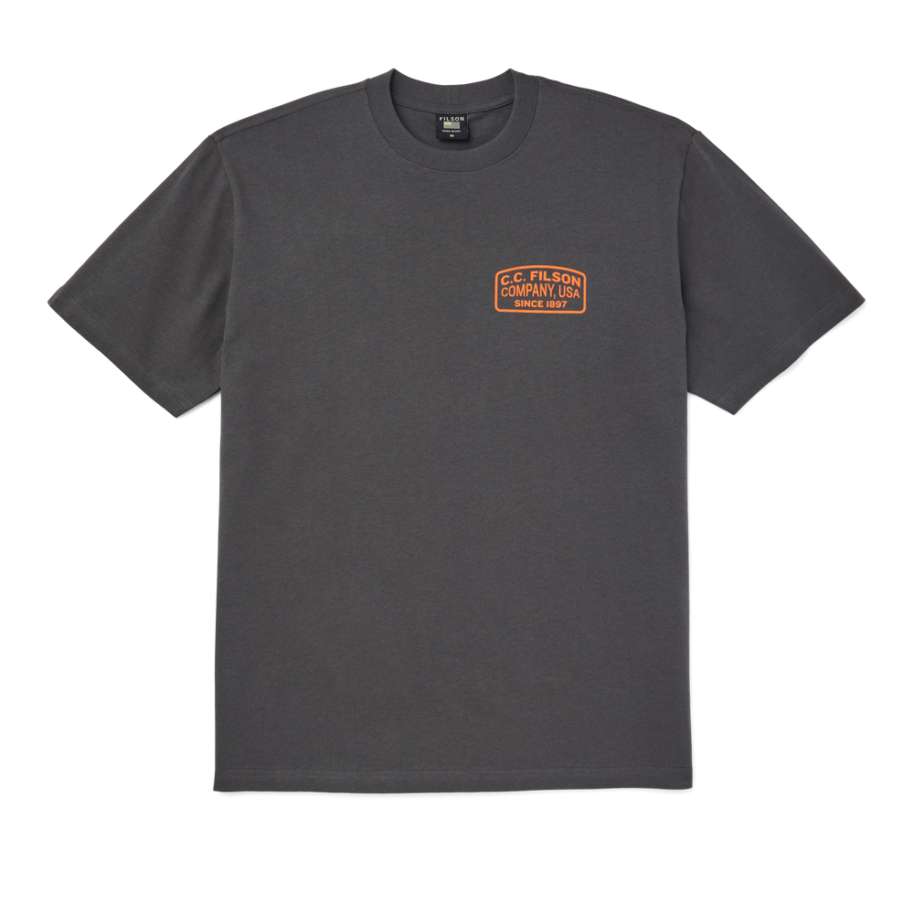 main image of filson's pioneer graphic t-shirt, a men's short sleeve knit shirt constructed in cotton, shown in charcoal / orange