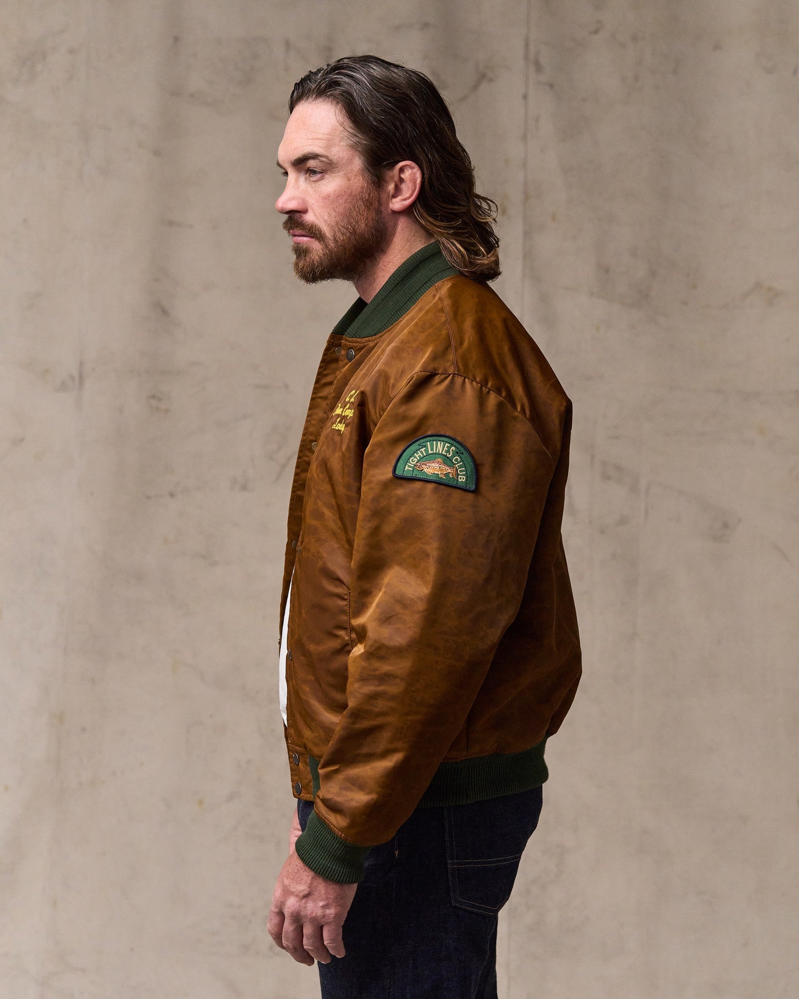 image of a model wearing Filson's Embroidered Montlake Jacket - Whiskey