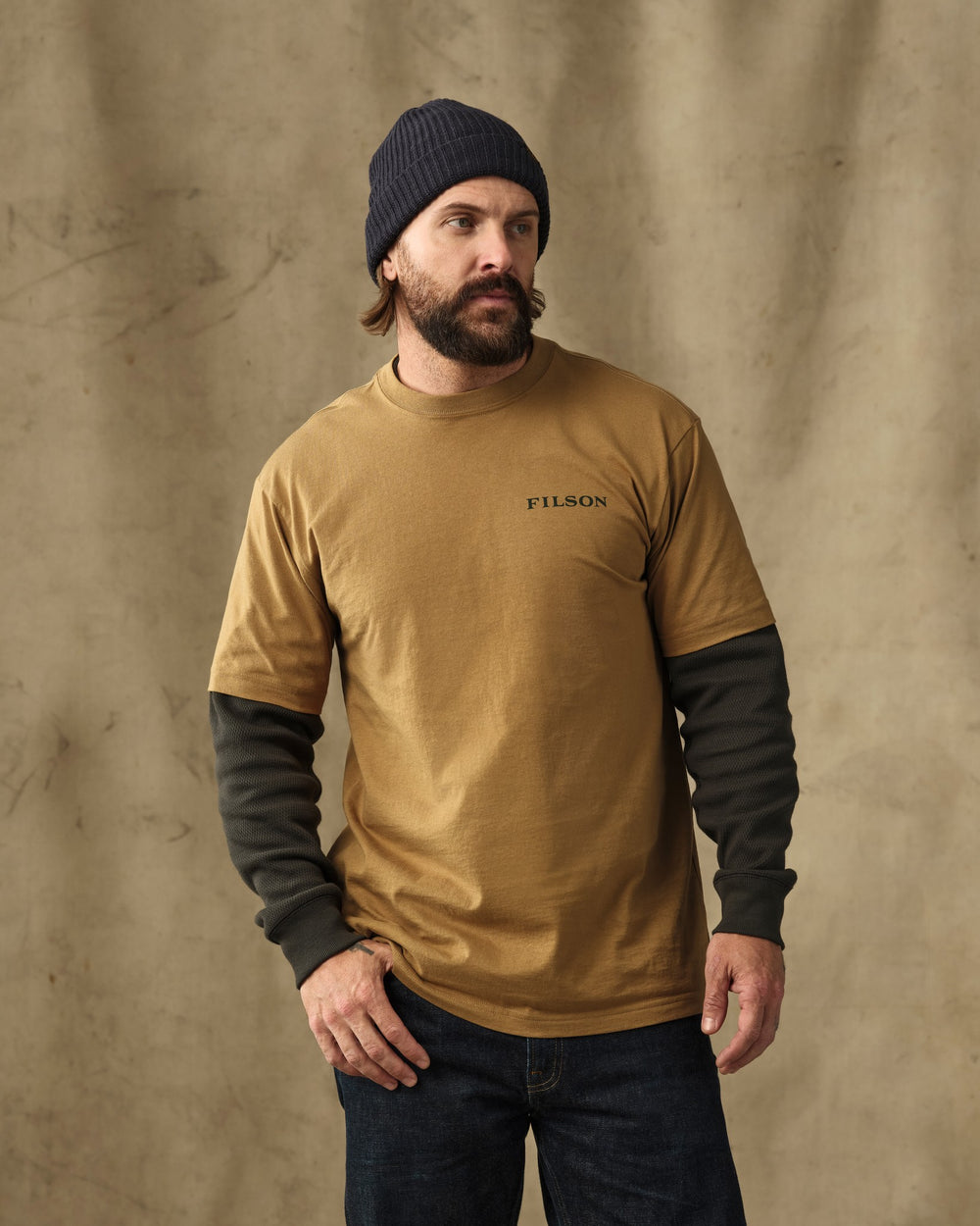 image of a model wearing Filson's Scenic Graphic T-Shirt - Dull Gold
