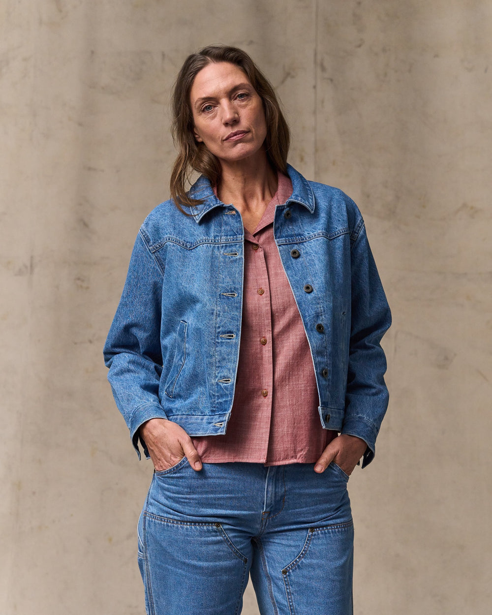 image of a model wearing Filson's Women's Western Denim Jacket - Light Indigo