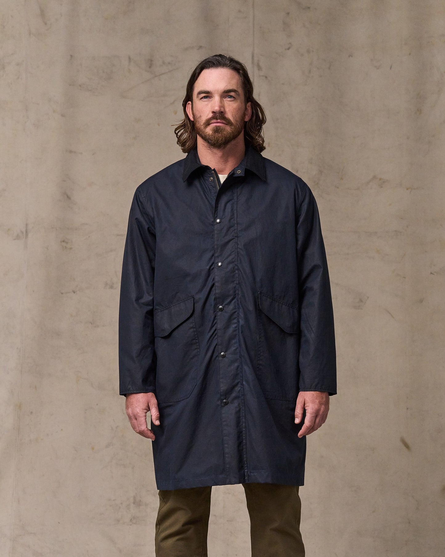 image of a model wearing Filson's Cover Cloth Trench Coat - Harbor Blue|Model is 6'1" wearing a size medium