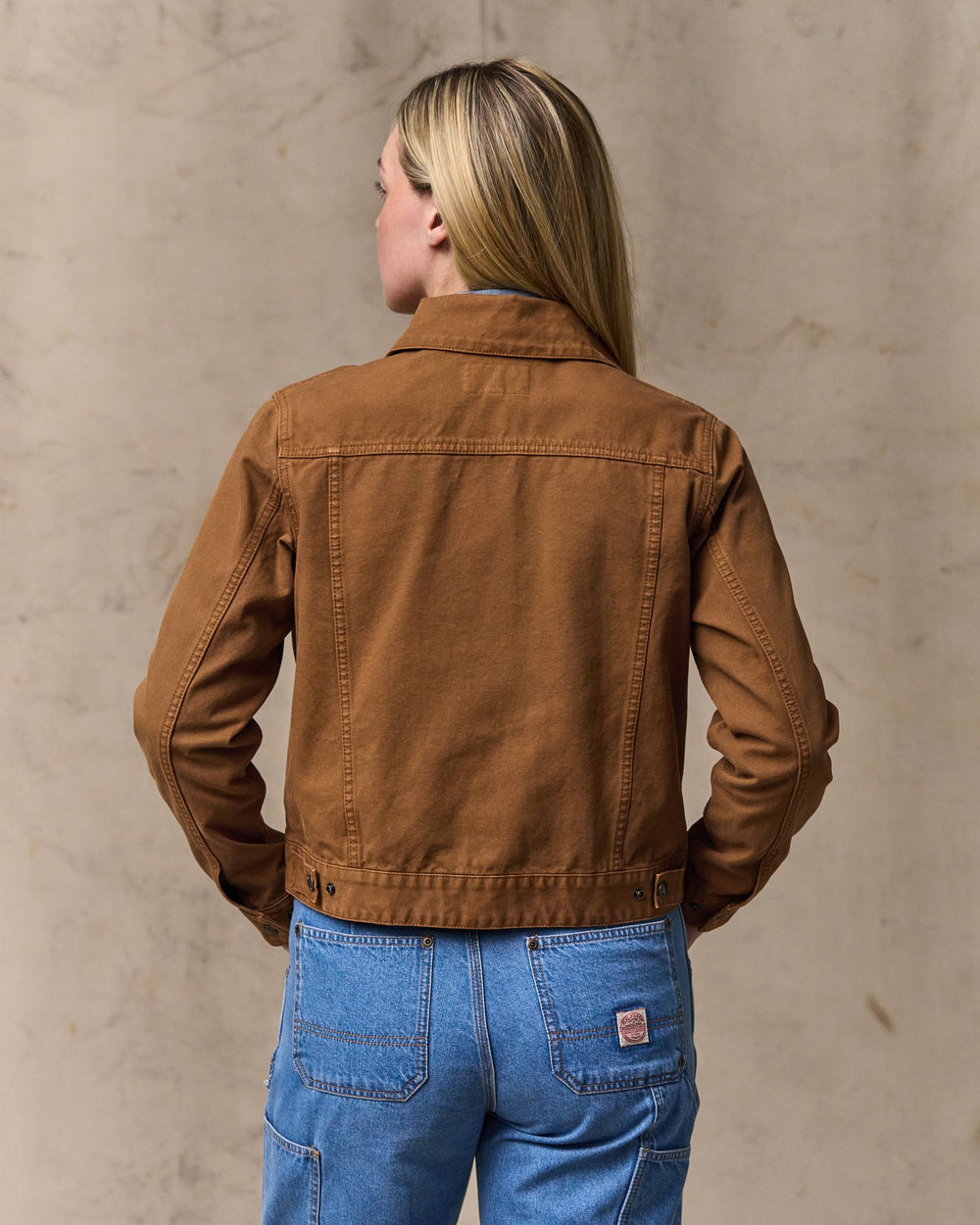 image of a model wearing Filson's Women's Canvas Short Cruiser Jacket - Harvest Tan