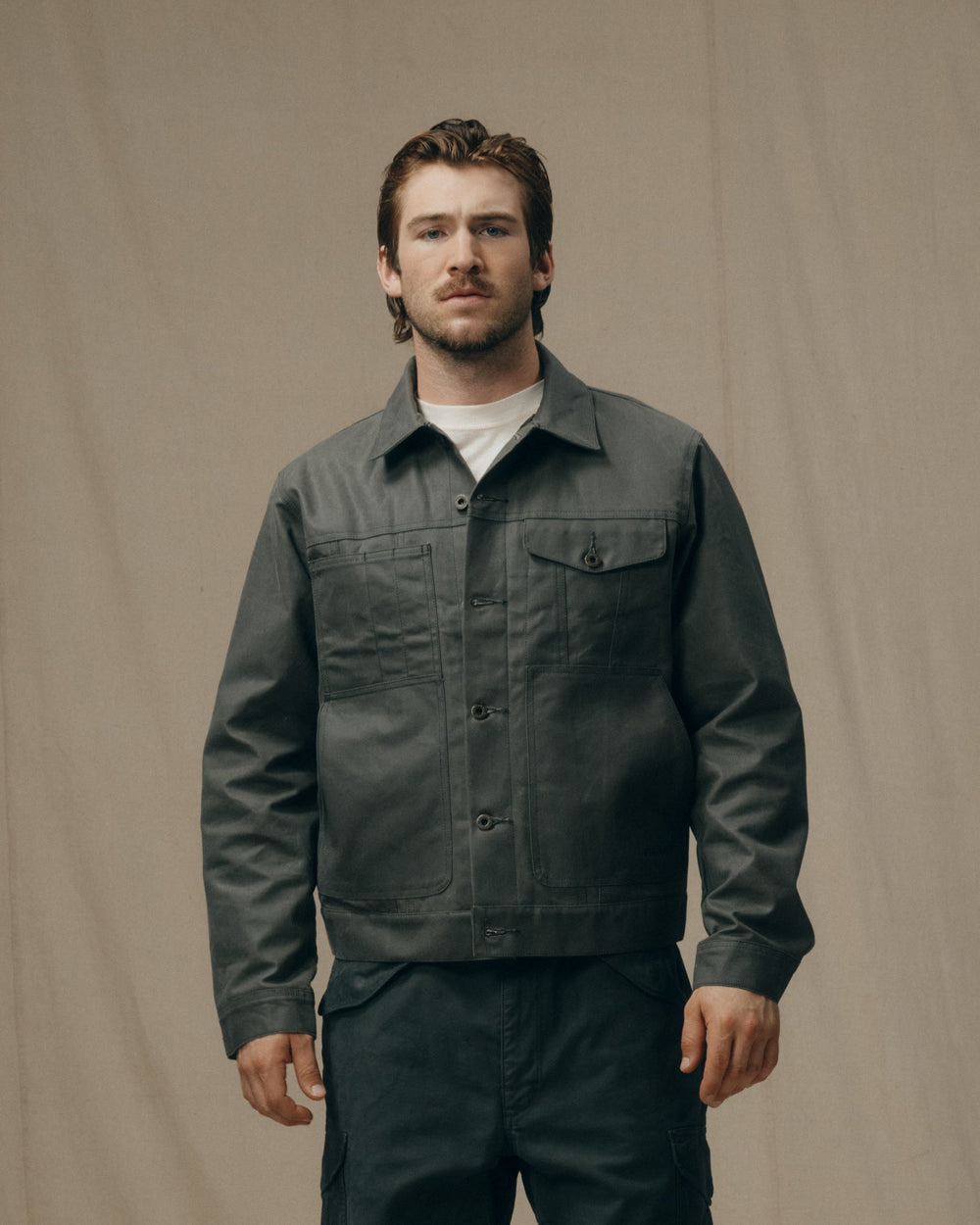 image of a model wearing Filson's Tin Cloth Short Lined Cruiser Jacket - Castor Gray