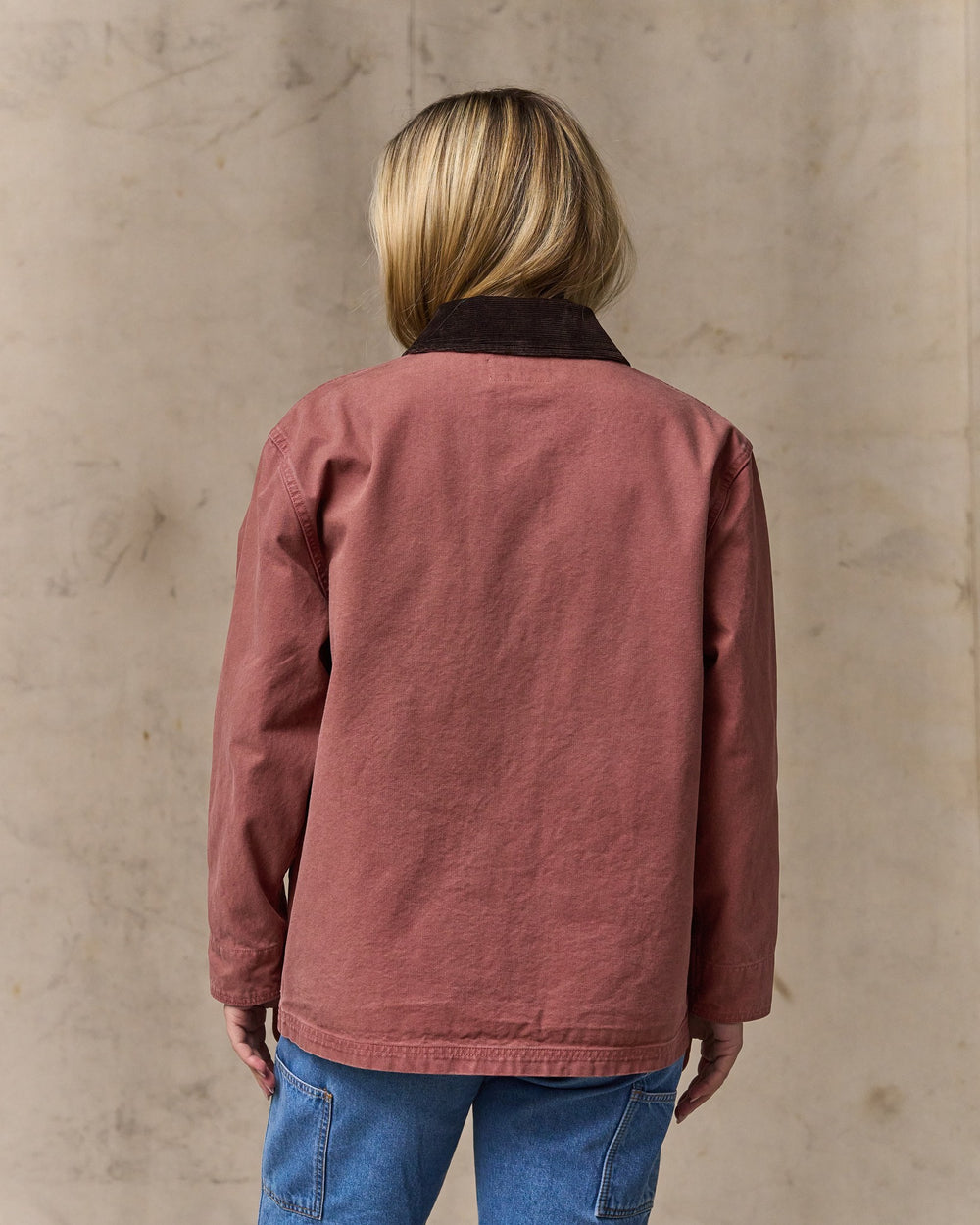 image of a model wearing Filson's Women's Canvas Barn Coat - Mahogany