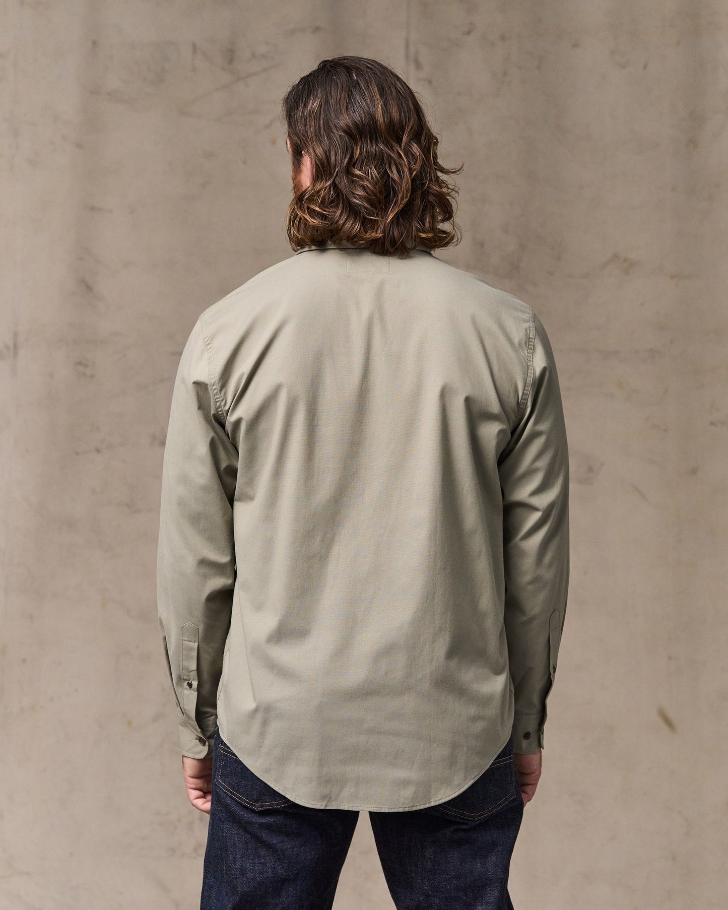 image of a model wearing Filson's Twin Lakes Sport Shirt - Dark Clay