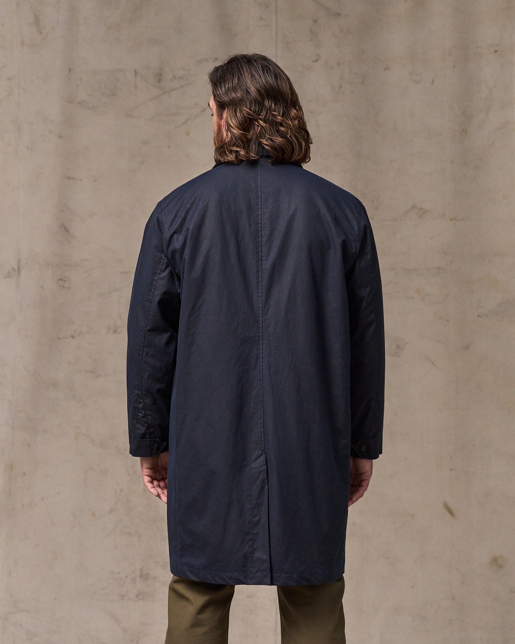 image of a model wearing Filson's Cover Cloth Trench Coat - Harbor Blue