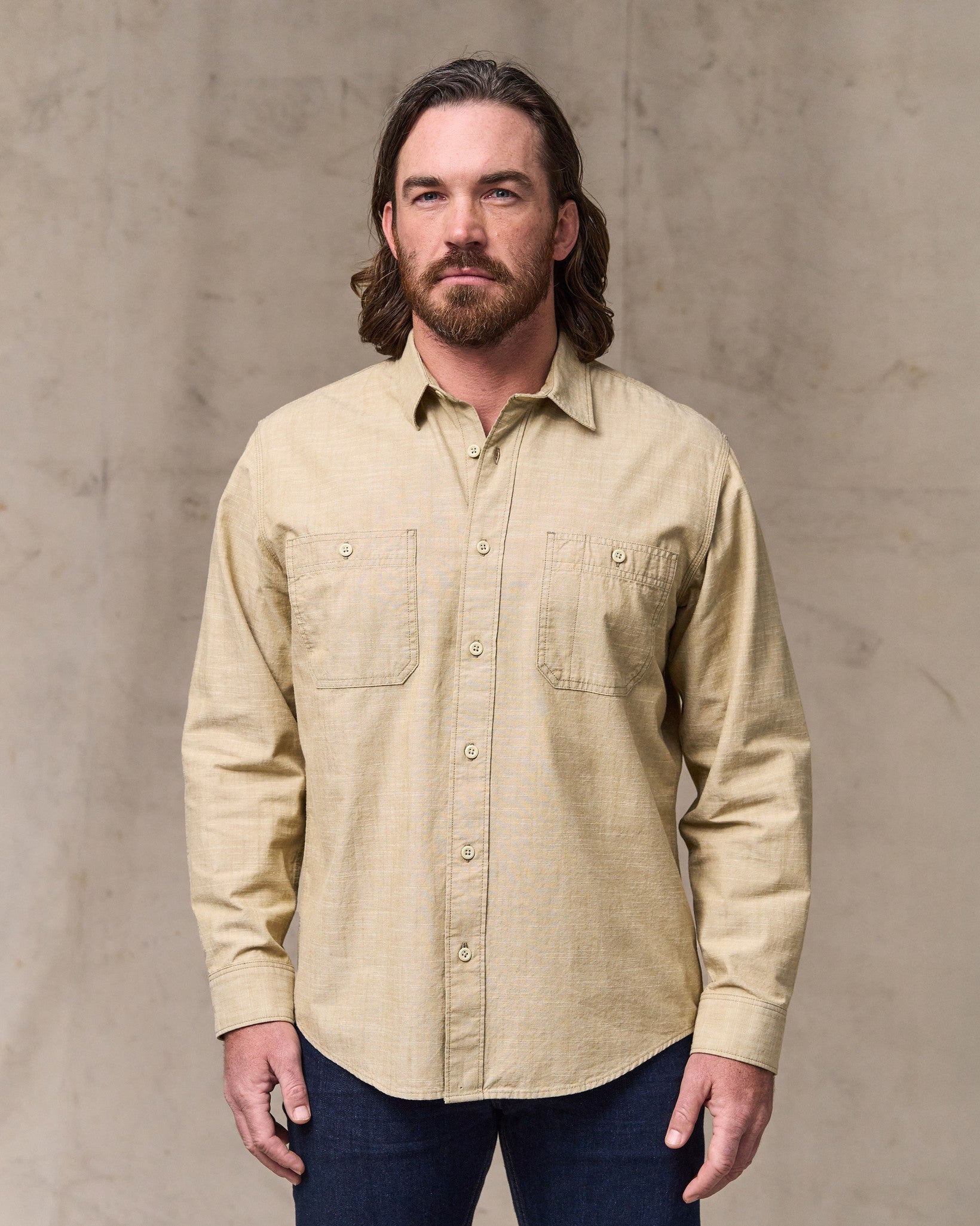 image of a model wearing Filson's Chambray Cpo Shirt - Tan