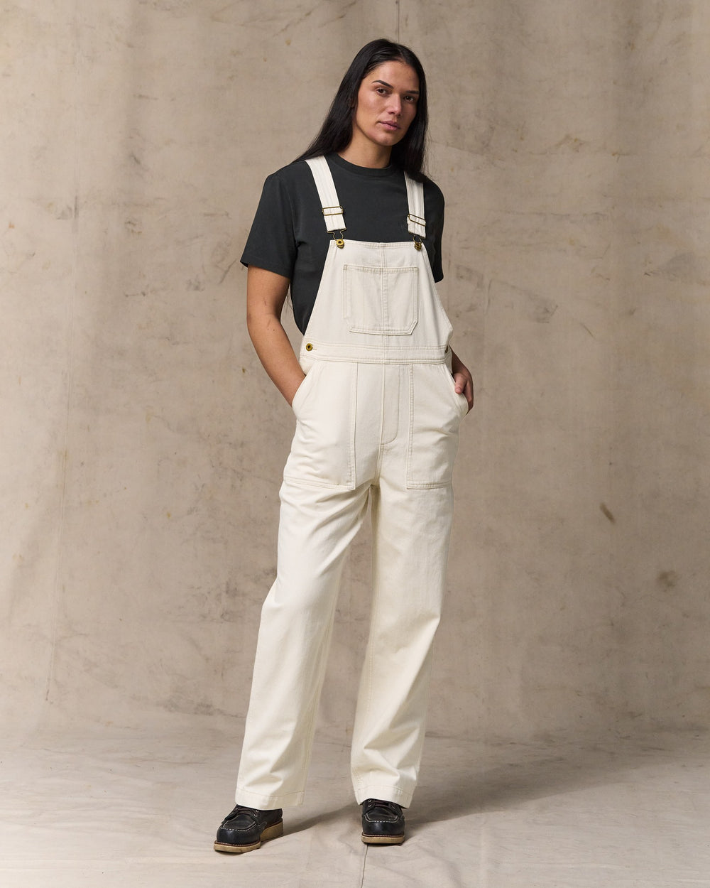 image of a model wearing Filson's Women's Denim Overalls - Natural Seed