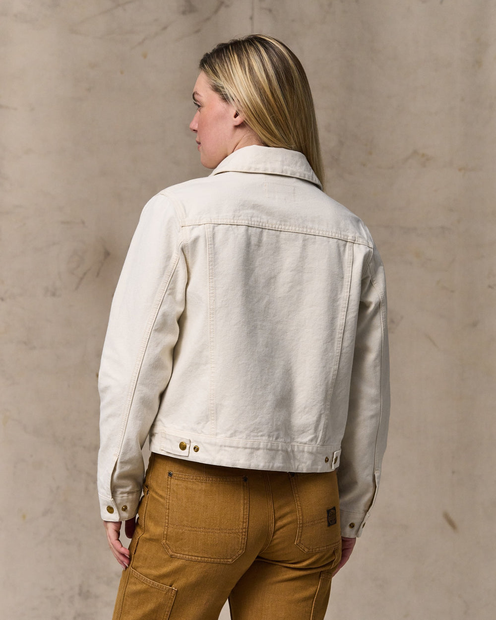 image of a model wearing Filson's Women's Canvas Short Cruiser Jacket - Natural Seed