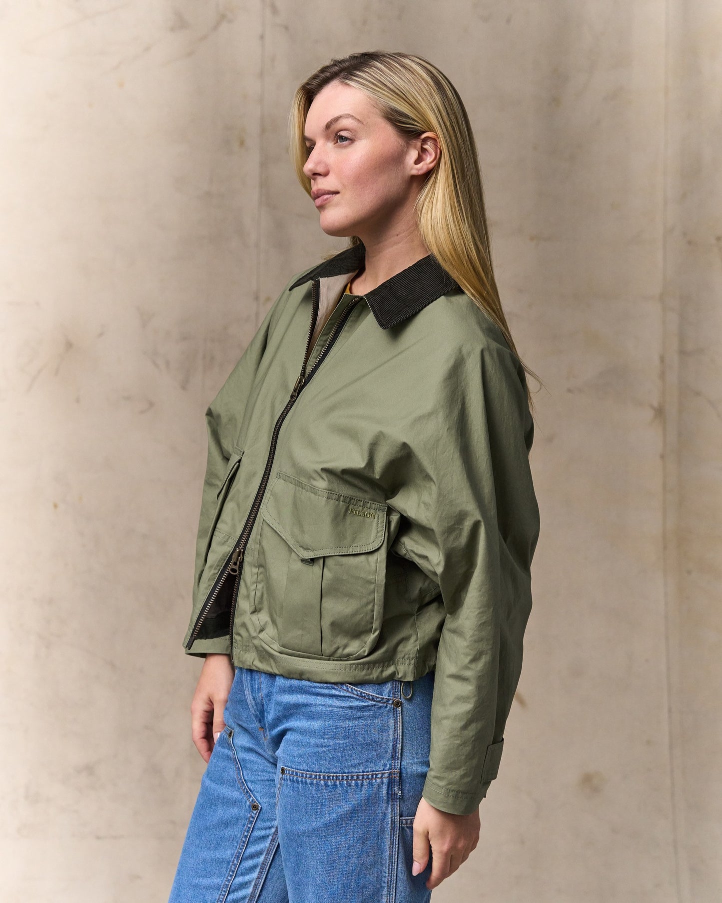 image of a model wearing Filson's Women's Dry Wax Short Work Jacket - Slate Olive