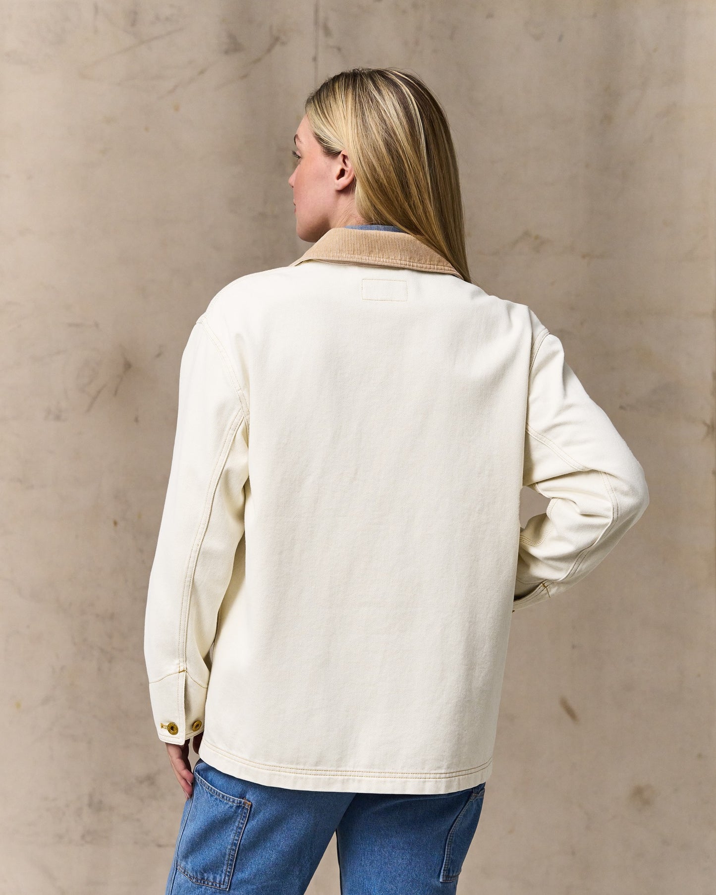 image of a model wearing Filson's Women's 11-oz. Denim Barn Coat - Natural Seed