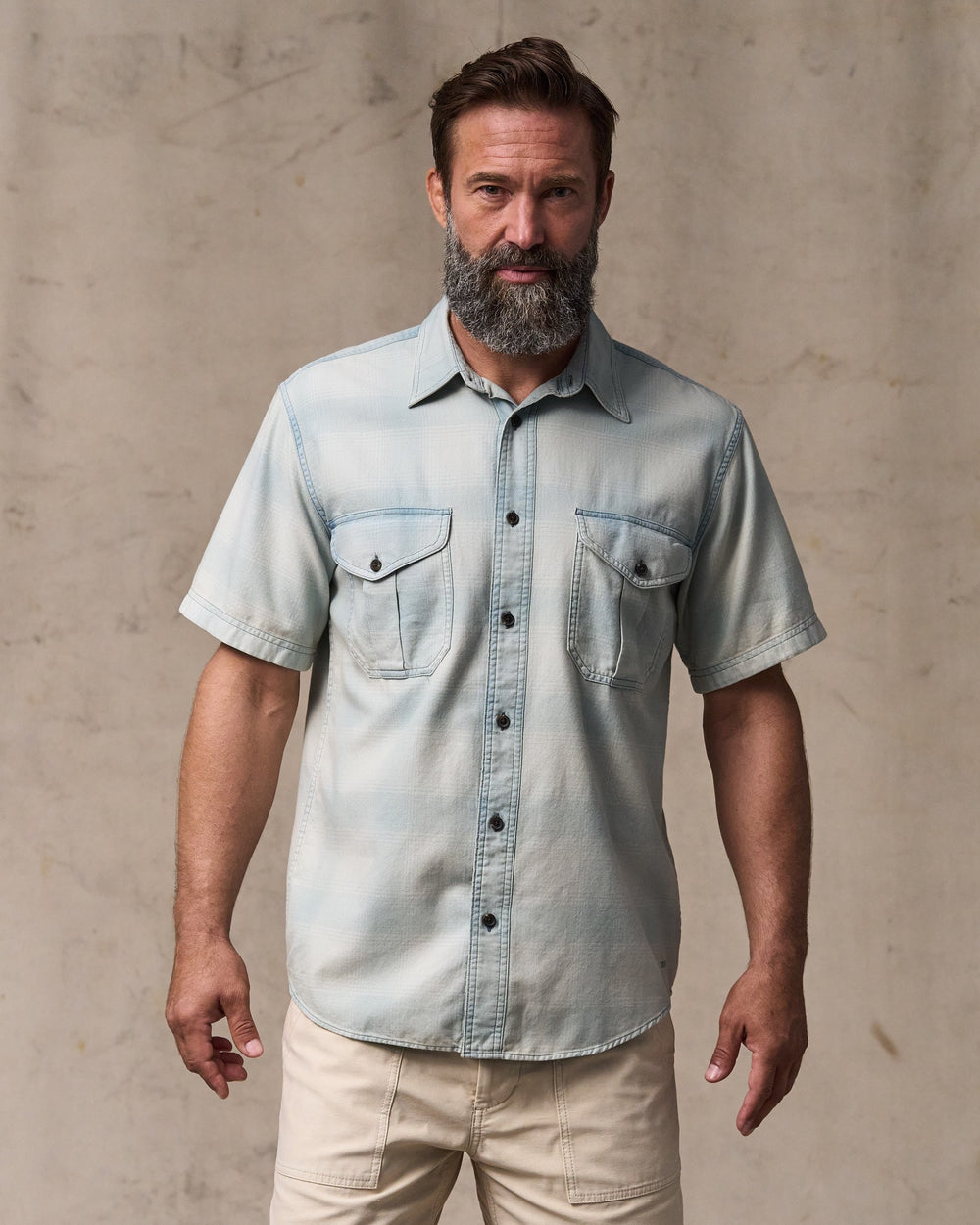 image of a model wearing Filson's Short Sleeve Lightweight Alaskan Guide Shirt  - Indigo Plaid