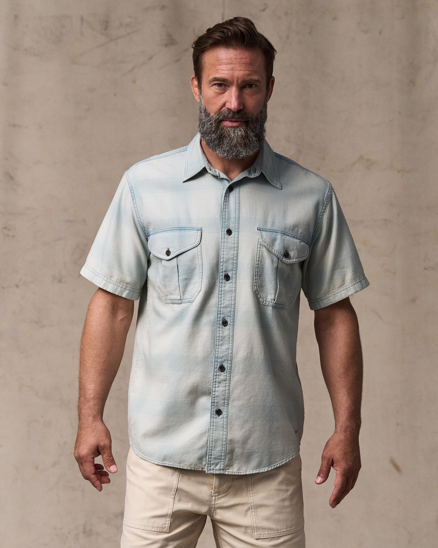 image of a model wearing Filson's Short Sleeve Lightweight Alaskan Guide Shirt  - Indigo Plaid|Model is 6'1" wearing a size medium