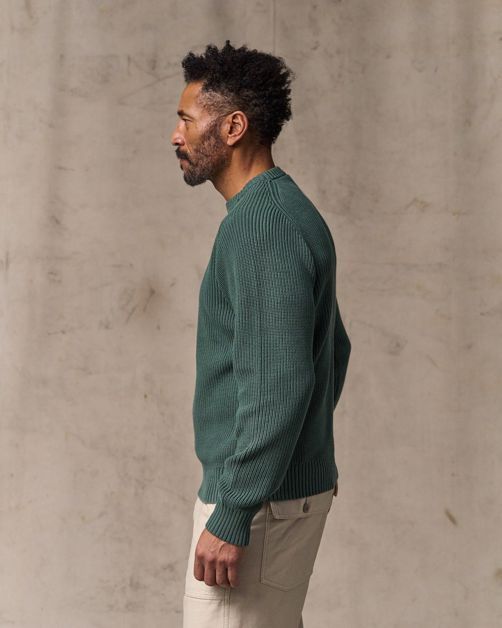 image of a model wearing Filson's Vintage Cotton Crewneck Sweater - Juniper