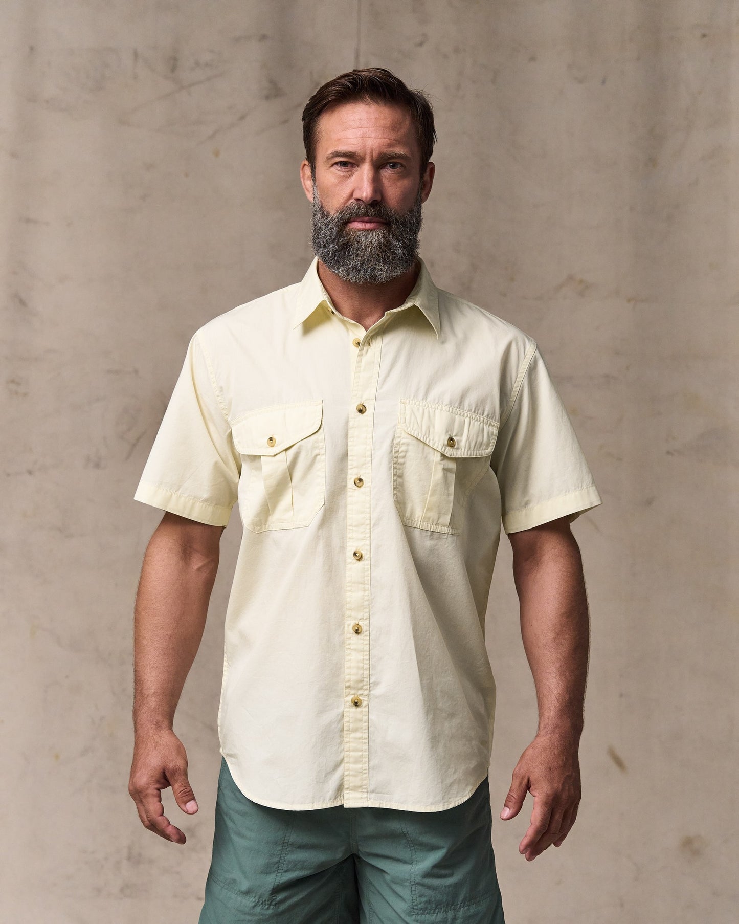 image of a model wearing Filson's Filson's Washed Short Sleeve Feather Cloth Shirt - Ivory|Model is 6'1" wearing a size medium