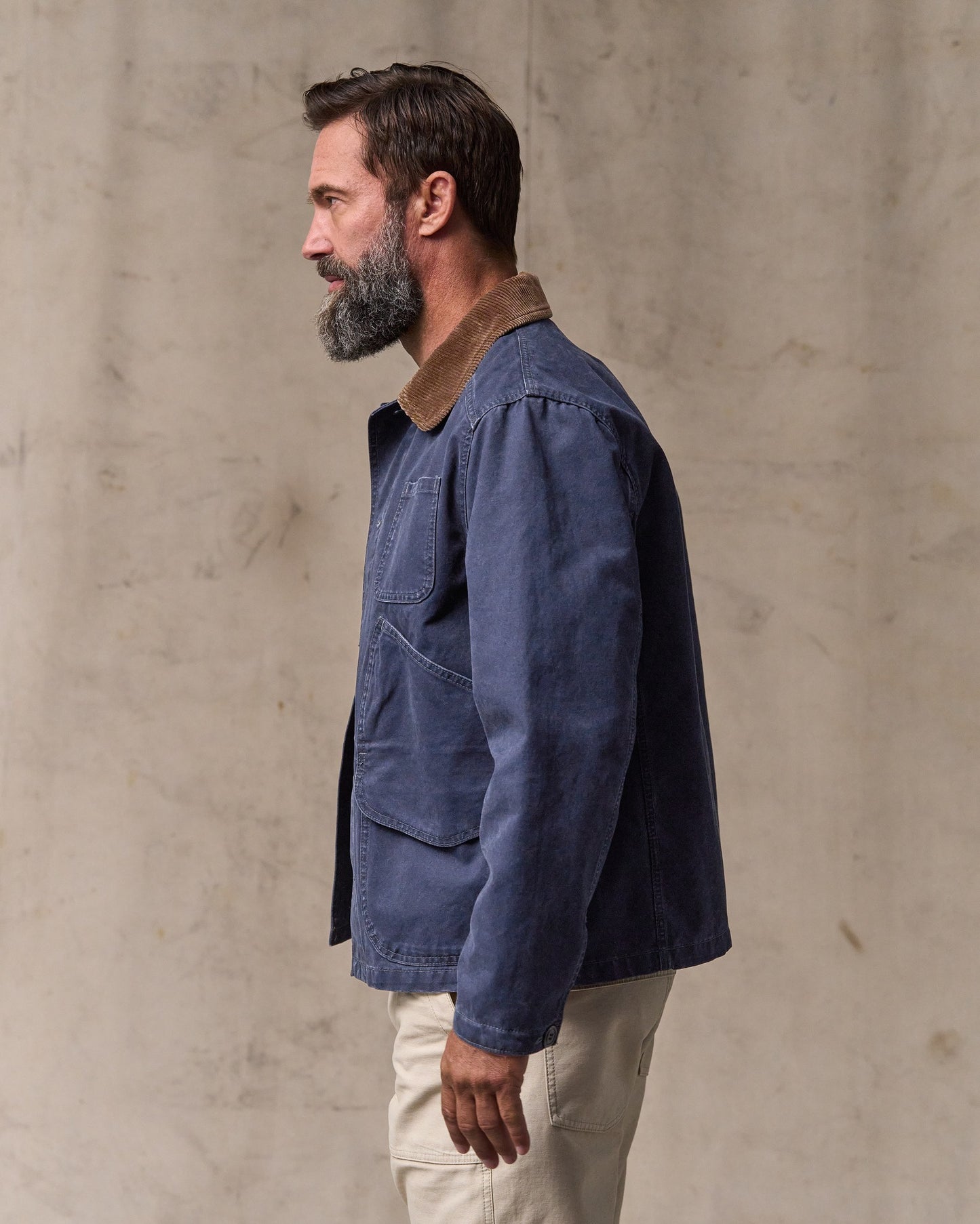 image of a model wearing Filson's Canvas Outfitter Jacket - Blue Mussel