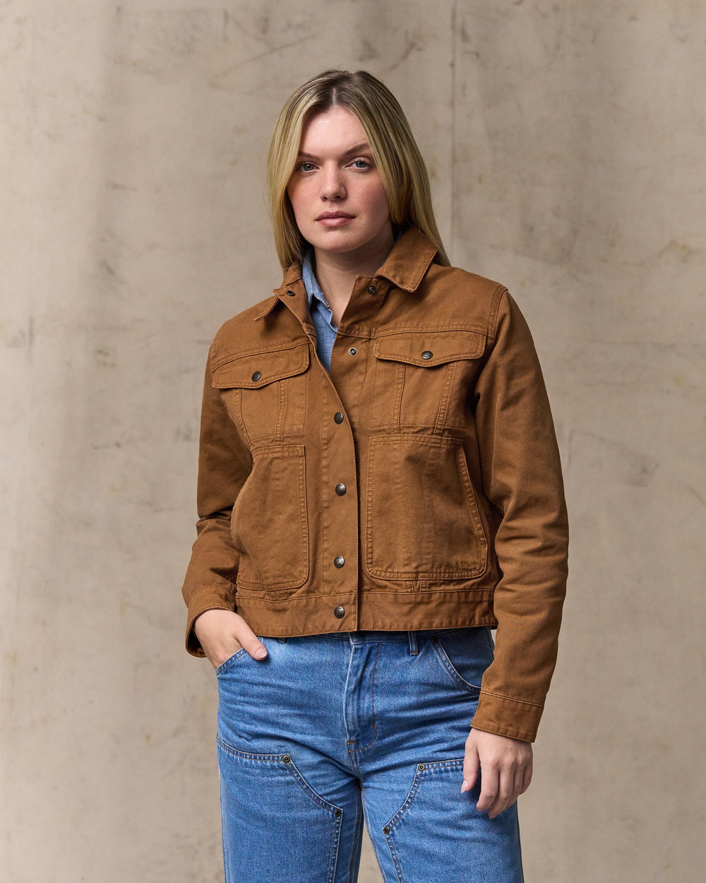 image of a model wearing Filson's Women's Canvas Short Cruiser Jacket - Harvest Tan
