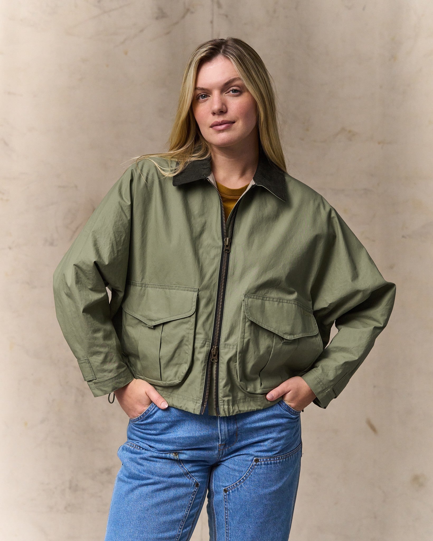 image of a model wearing Filson's Women's Dry Wax Short Work Jacket - Slate Olive