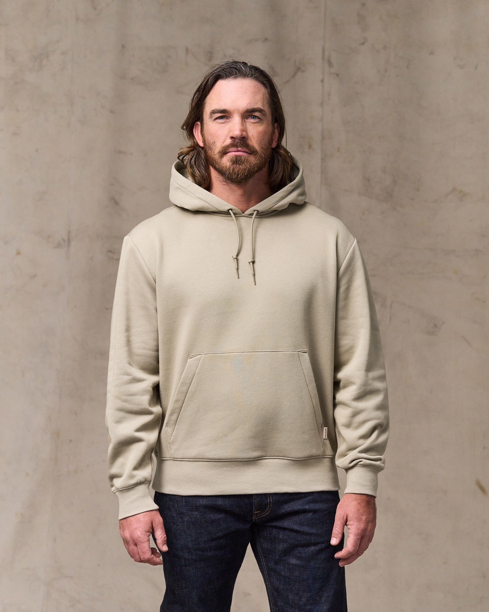 image of a model wearing Filson's Northwest Hoodie - Silver Sage
