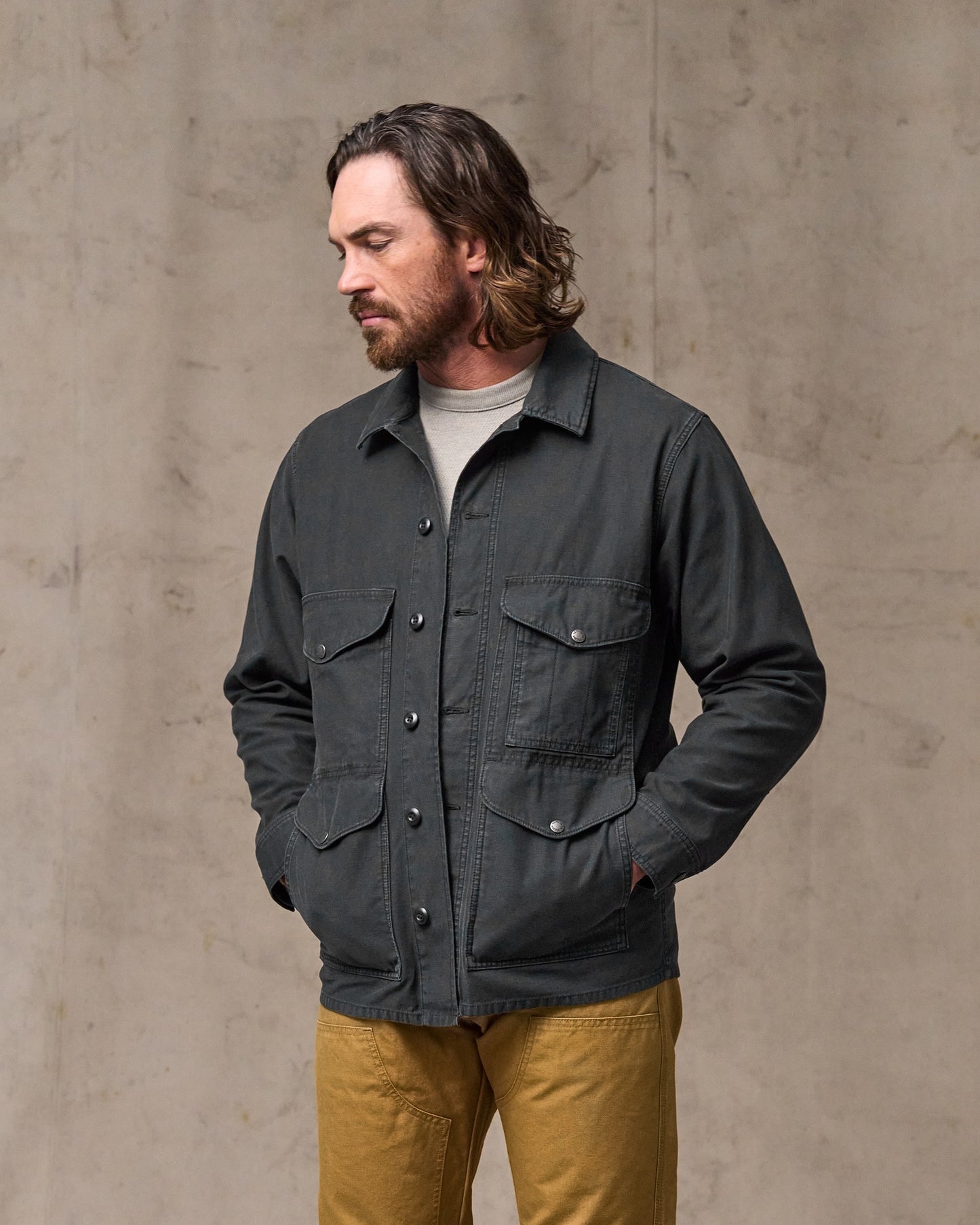 image of a model wearing Filson's Field Cruiser Jacket - Washed Faded Black