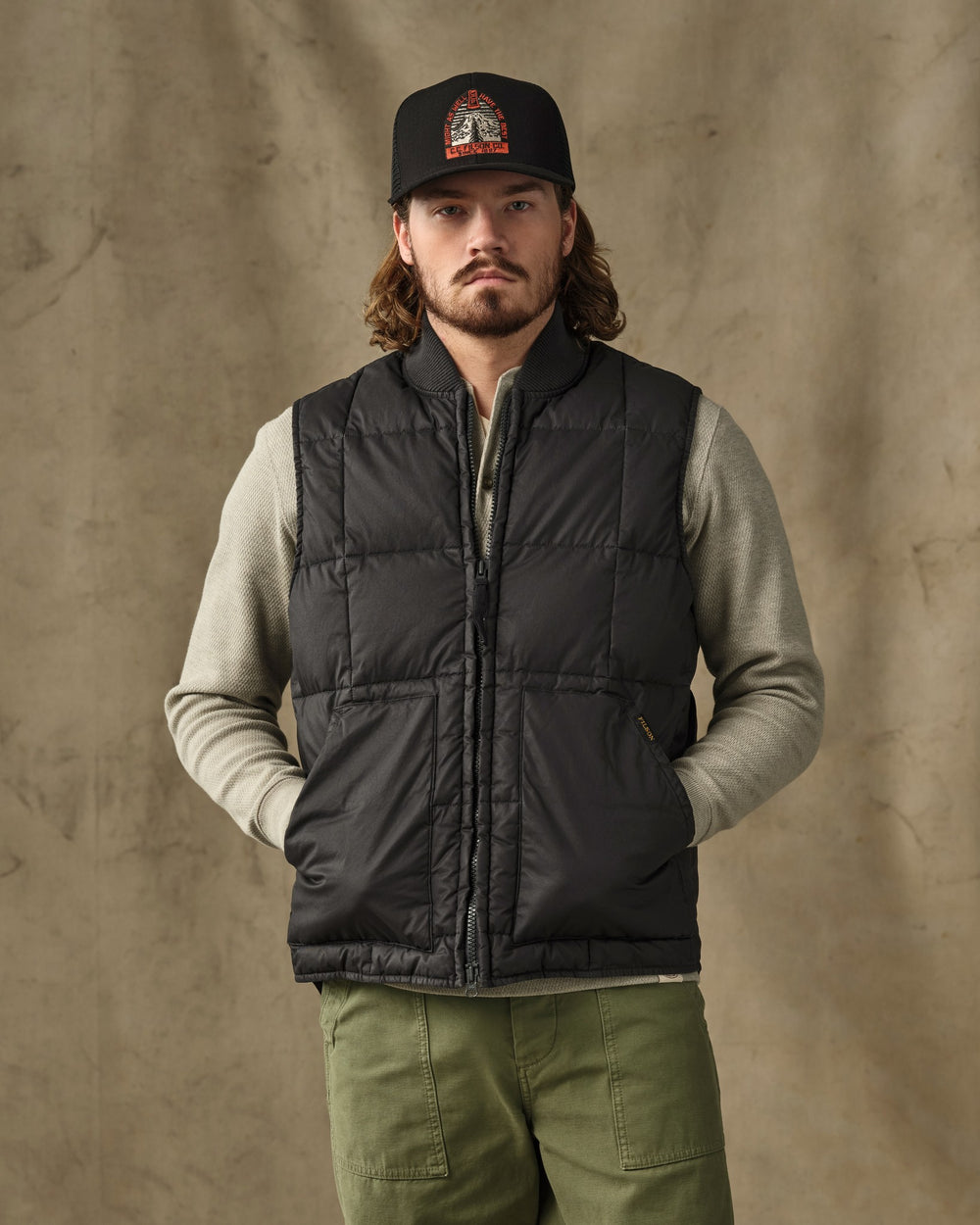 image of a model wearing Filson's Heritage Cotton Down Vest - Black