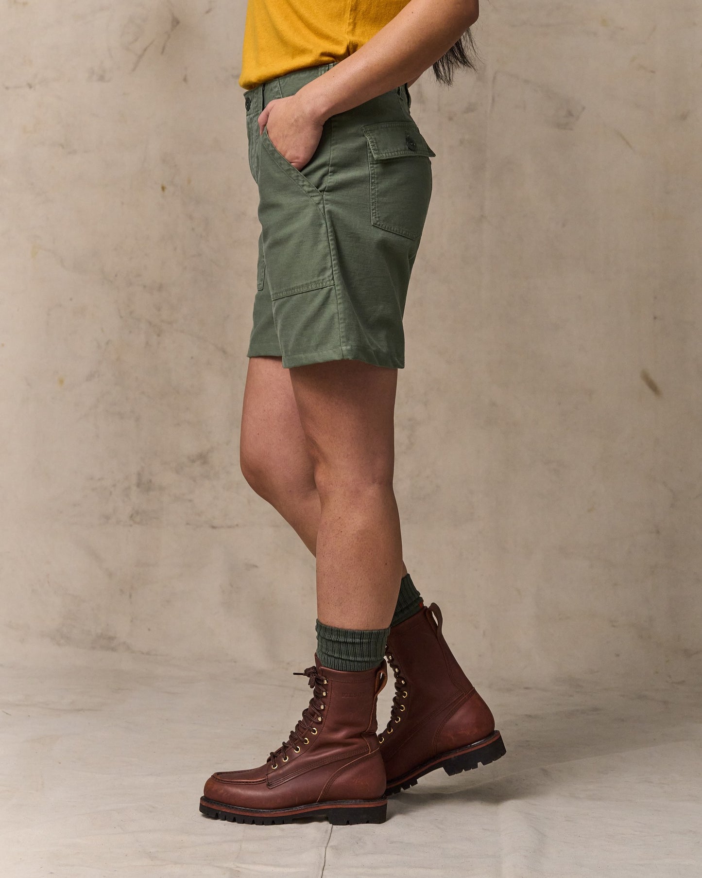 image of a model wearing Filson's Women's Reverse Sateen Supply Shorts - Service Green