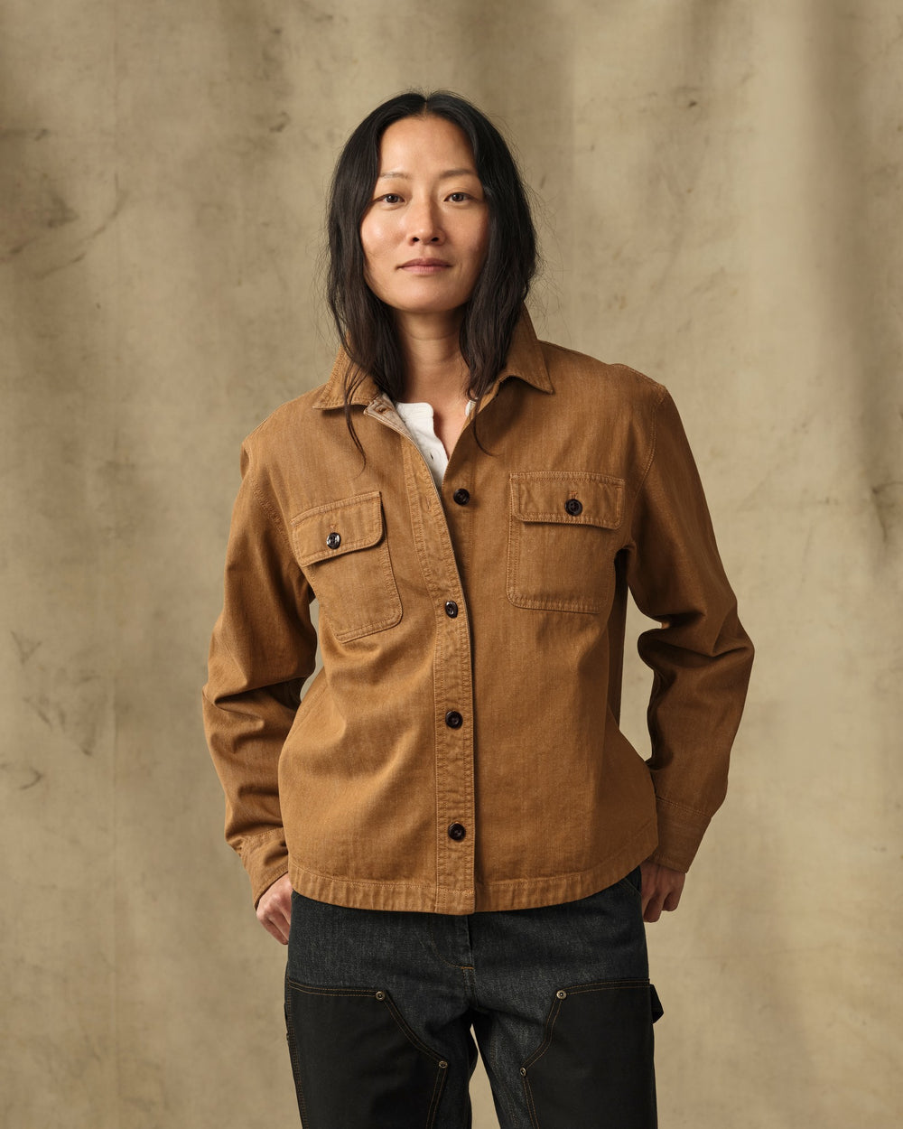 image of a model wearing Filson's Women's Denim Shirt - Harvest Tan