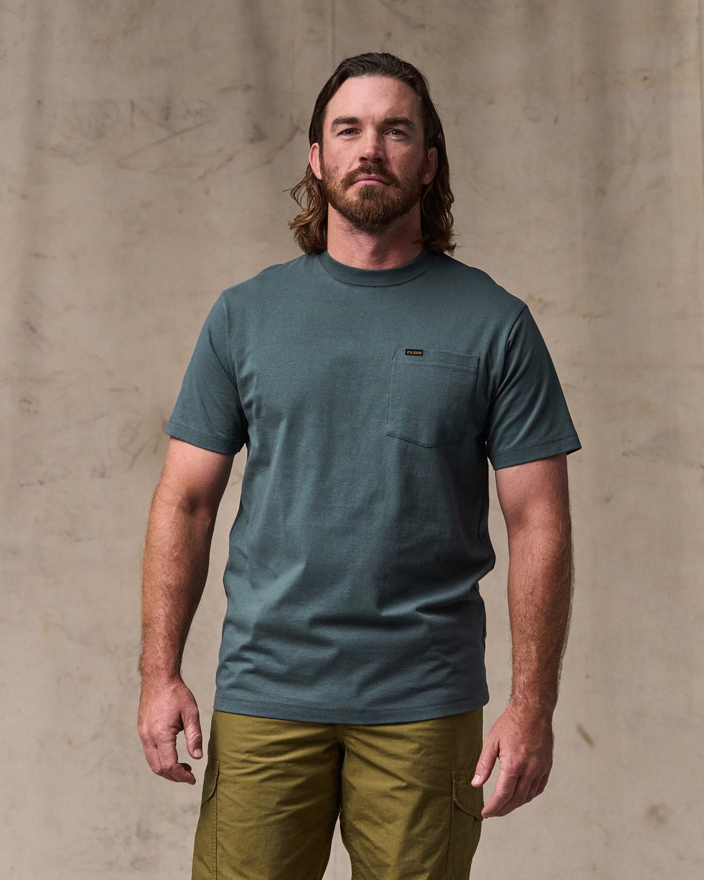 image of a model wearing Filson's Outfitter Pocket T-shirt - Dark Slate