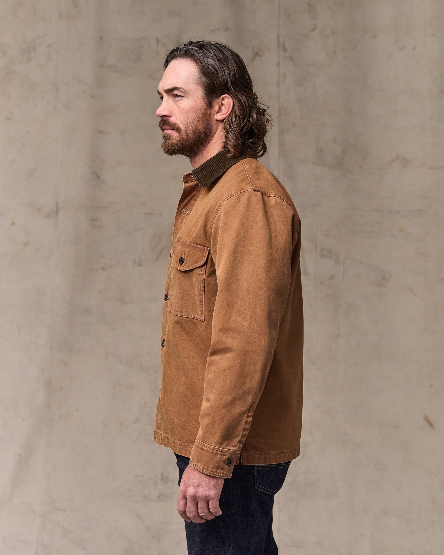 image of a model wearing Filson's Rustic Canvas Jac-shirt - Whiskey