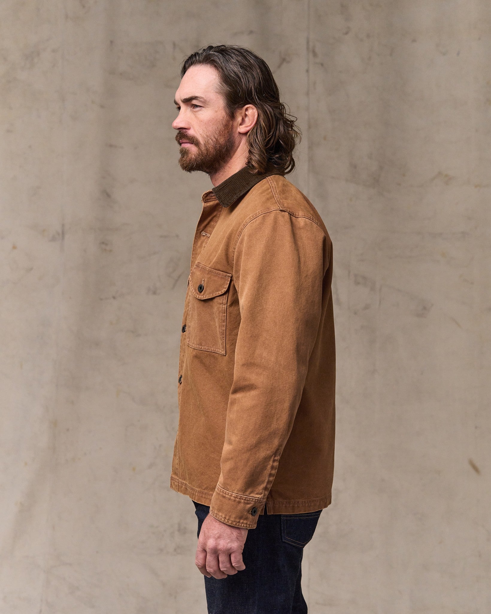 image of a model wearing Filson's Rustic Canvas Jac-shirt - Whiskey