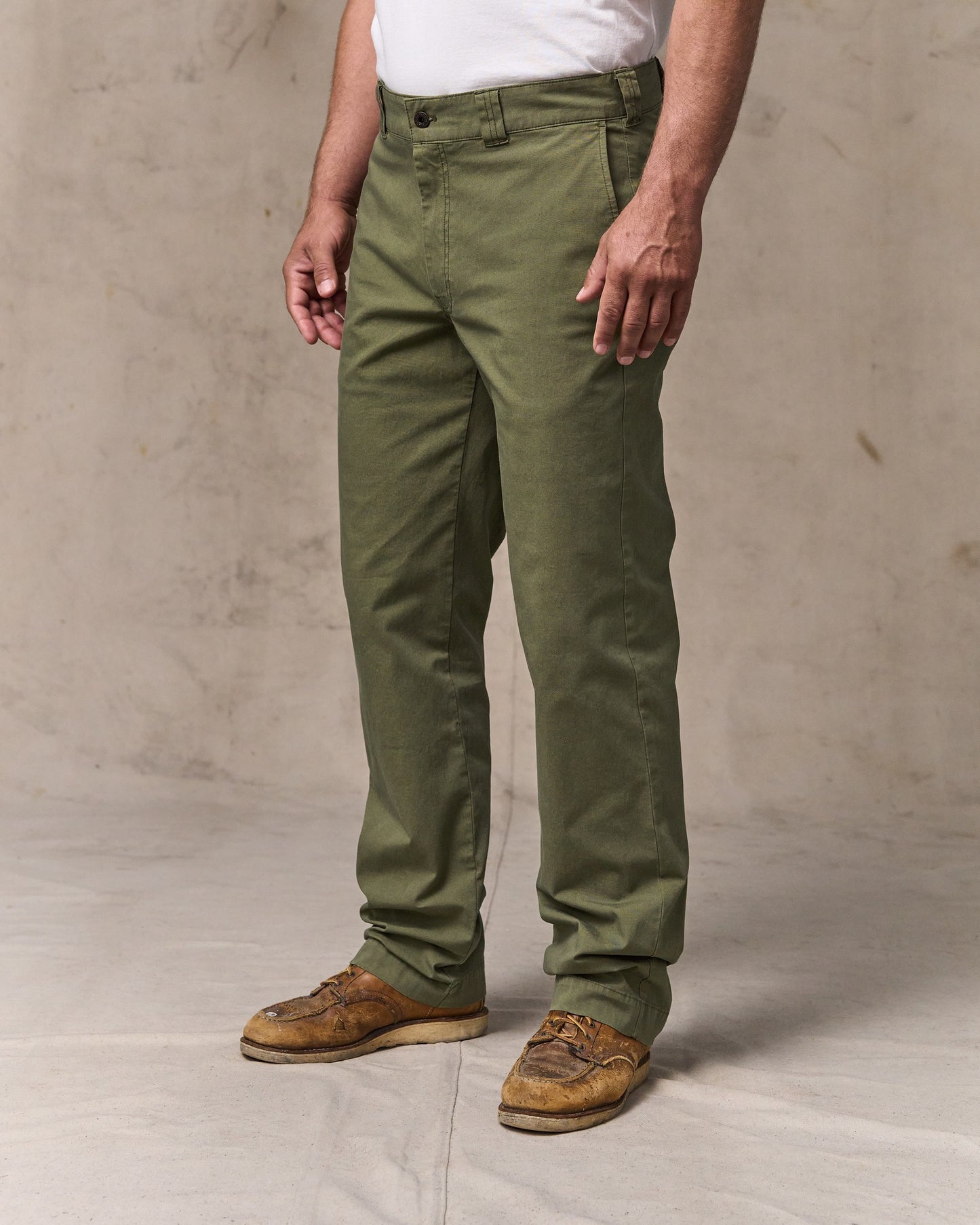 image of a model wearing Filson's Granite Mountain Flat Front Pants - Burnt Olive