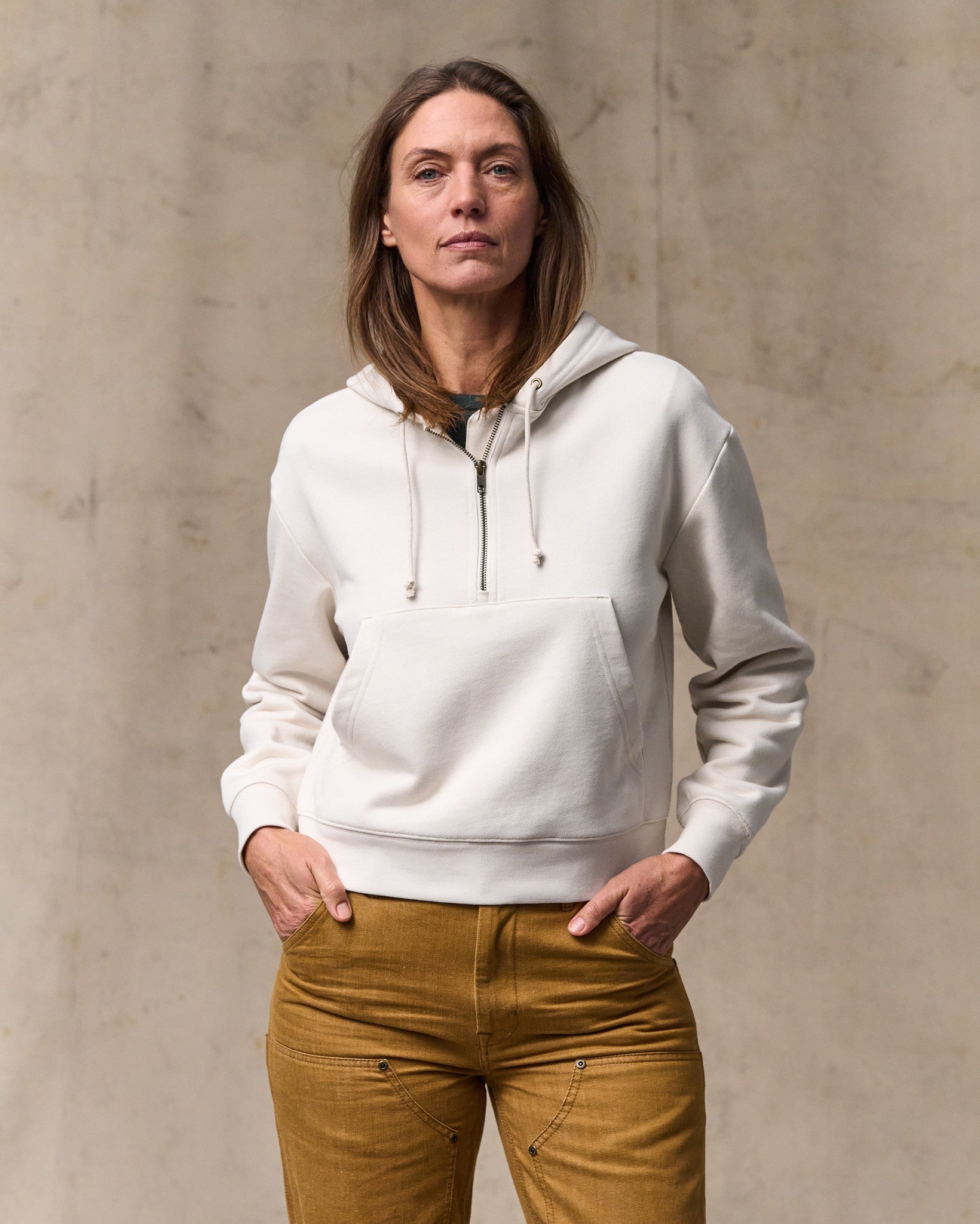 image of a model wearing Filson's Women's French Terry Half-zip Hoodie - Ivory