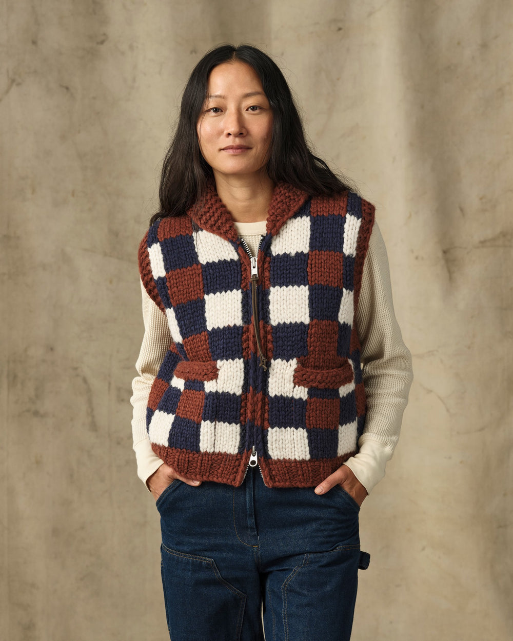 image of a model wearing Filson's Women's Handmade Sweater Vest - Maroon / Navy Multi