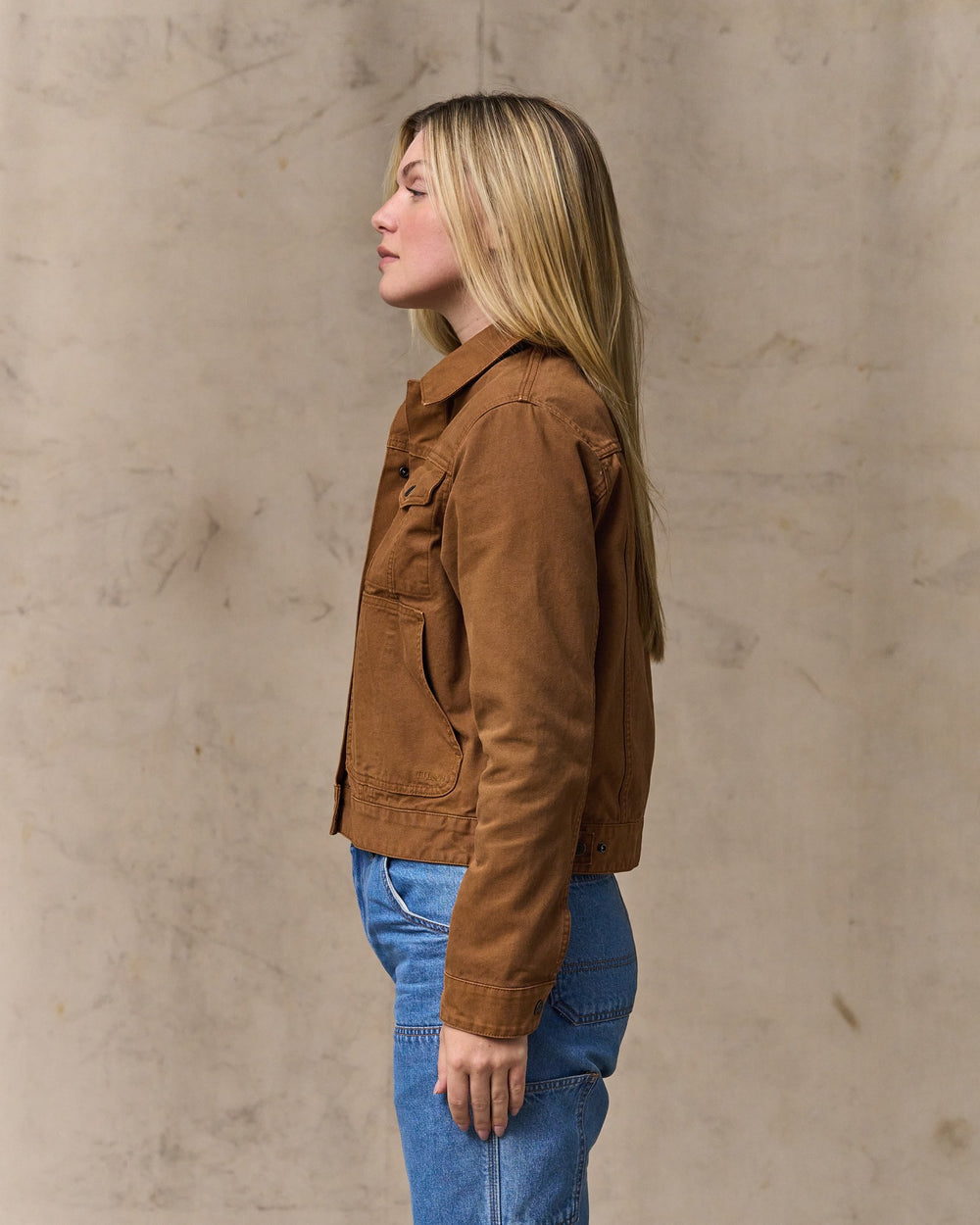 image of a model wearing Filson's Women's Canvas Short Cruiser Jacket - Harvest Tan