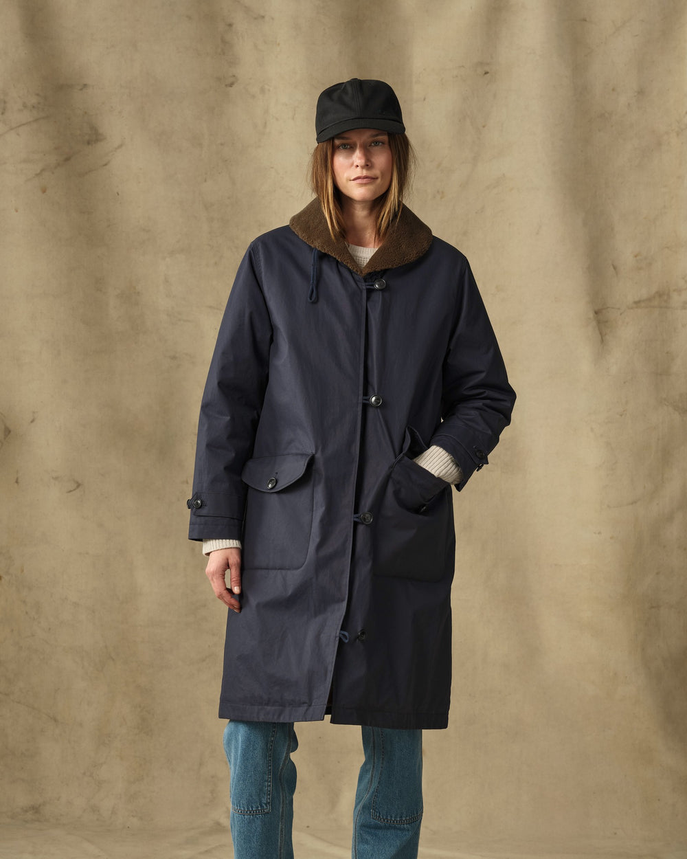 image of a model wearing Filson's Women's Harbor Front Trench Coat - Blue