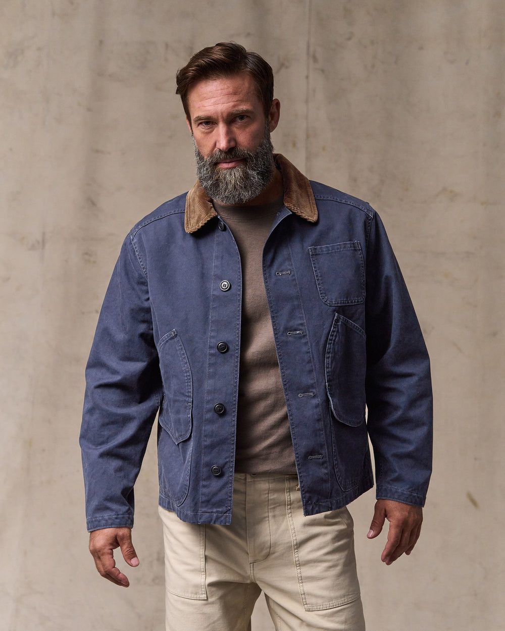 image of a model wearing Filson's Canvas Outfitter Jacket - Blue Mussel