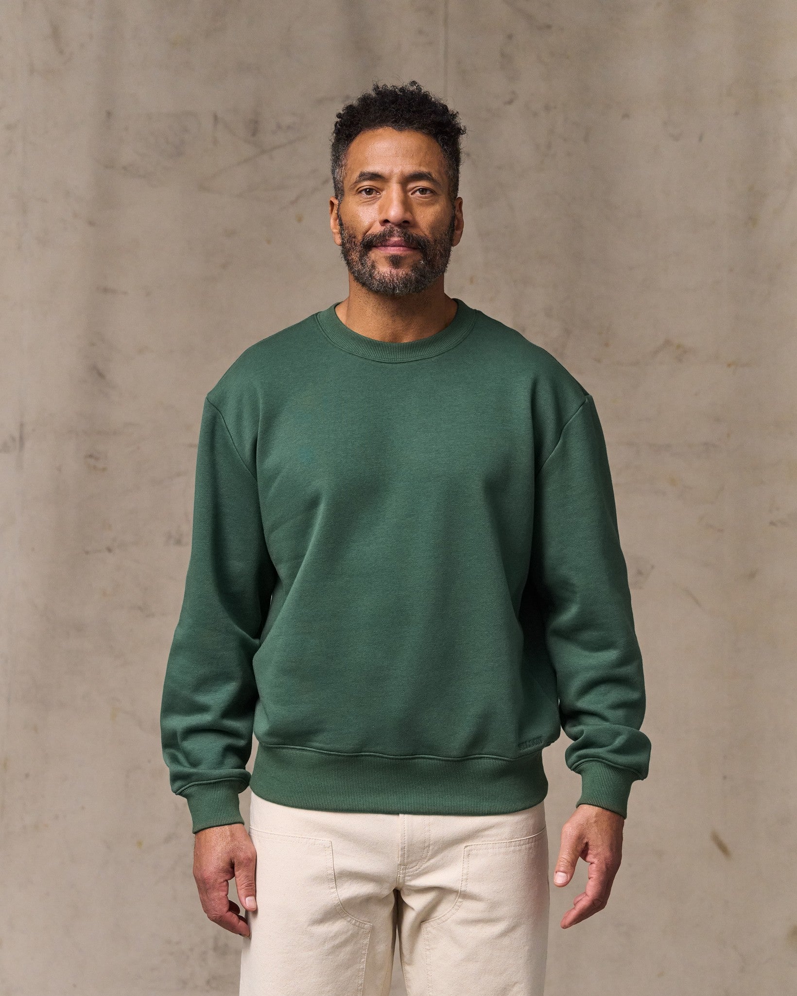 image of a model wearing Filson's Northwest Crewneck Sweatshirt - Granite Green