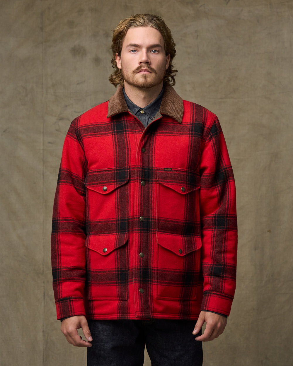 image of a model wearing Filson's Spokane Insulated Cruiser Jacket - Red / Black Windowpane