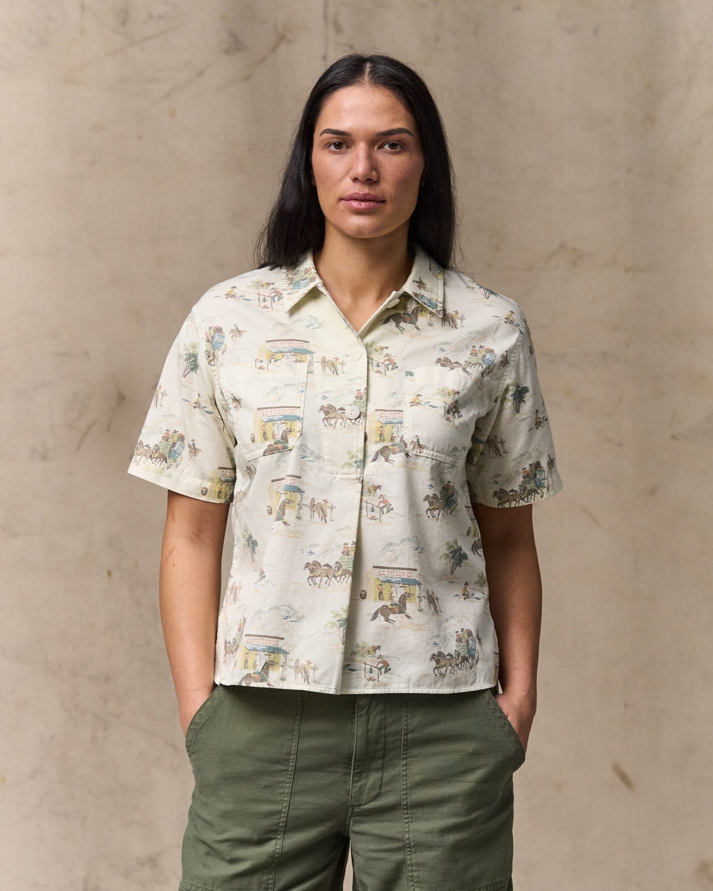 image of a model wearing Filson's Women's Twill Popover Shirt - Desert Natural / Print|Model is 5'10" wearing a size medium